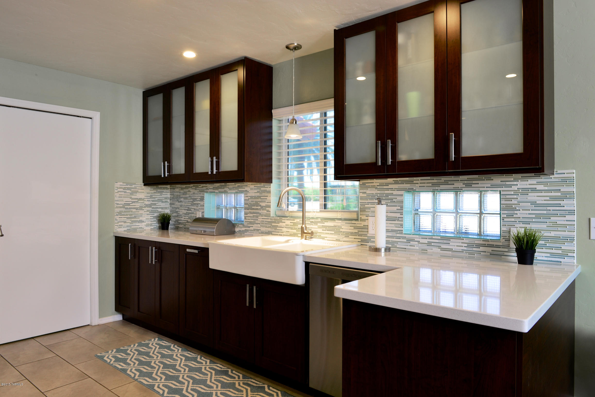 Charm and character from 1948 meets modern amenities down to the last detail! This brick home w/ wood floors & ceramic tile throughout, new doors, incl sec doors. The Chef's kitchen is full sized w/ dark cabinets & handles, newer S/Steel appliances, the most durable quartz & granite counters & glass tile b/splash w/ a pantry. The laundry room off the kitchen has plenty of storage with modern cabinets. Bathrooms have been completely updated last year from top to bottom with contemporary finishes. More improvements include newer AC & windows, updated electric, replaced main water line, improved drainage & sewage along w/ landscaping & irrigation system, gas hookup in kitchen, smart home features with eco friendly digital thermostat, re-did closets. Guest House with premium $650 rent!