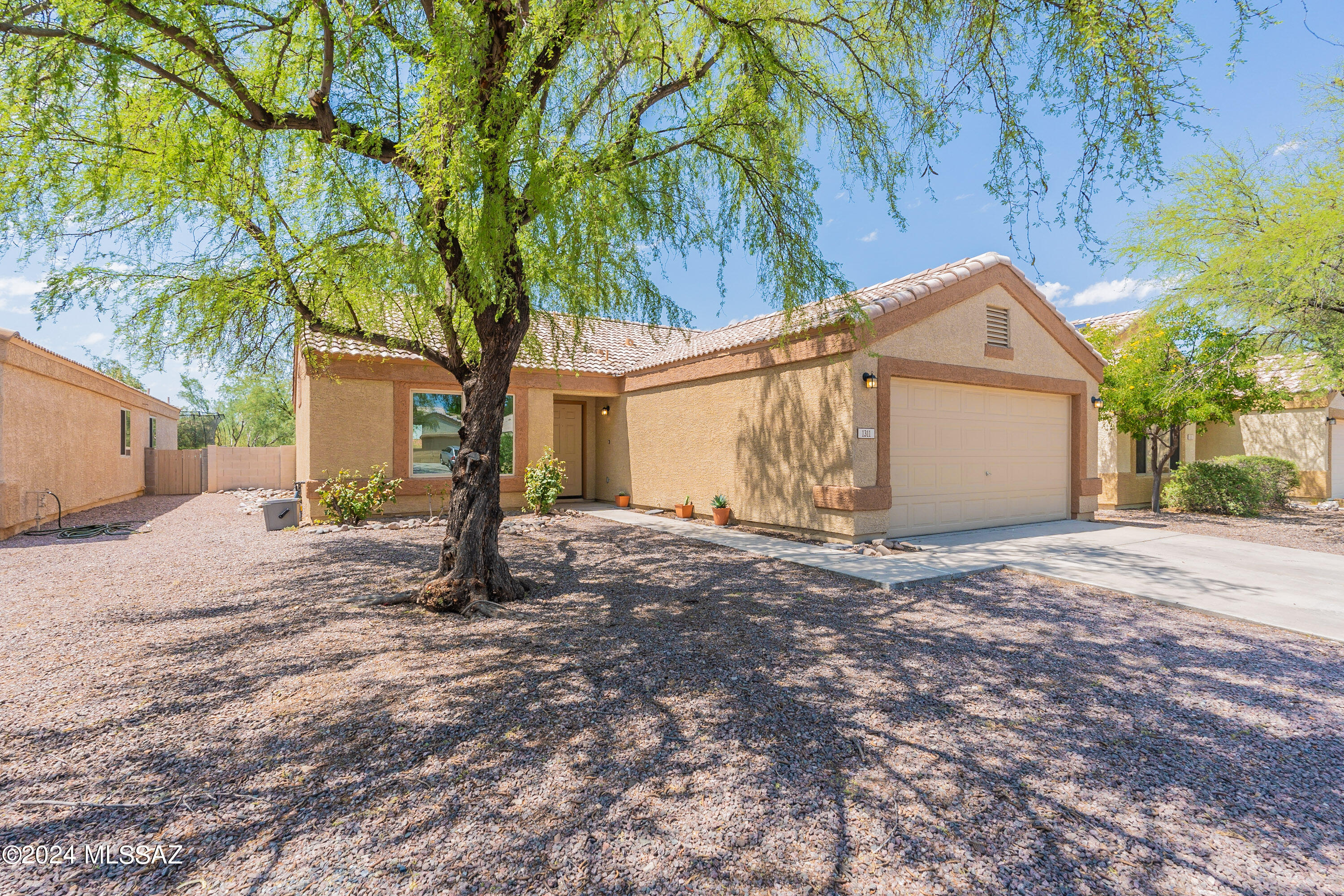This charming three-bedroom, two-bathroom house with owned solar panels is a fantastic opportunity for anyone looking for a spacious and well-maintained home in the welcoming and inviting Copper Creek neighborhood. With a spacious 1304 square feet of living space, this property is perfect for those who value comfort and convenience. With a spacious lot that boasts mature landscaping, creating a welcoming and inviting atmosphere. The interior of the house is bright and welcoming, with tiled flooring throughout the main living areas.
The kitchen is a standout feature of the property, with a spacious layout, abundant cabinetry. The kitchen also features ample natural and artificial lighting, as well as elegant fixtures, making it a great place to cook and entertain. The bedrooms are spacious and well-lit, with plenty of room for storage and relaxation. The bathrooms are well-maintained and feature ample counter space, bright lighting, and a spacious layout, making them a great place to unwind after a long day. The property also features a covered patio, lush landscaping, and a spacious backyard, perfect for outdoor entertaining and relaxation. The backyard is a great place to enjoy the beautiful weather and spend time with family and friends.