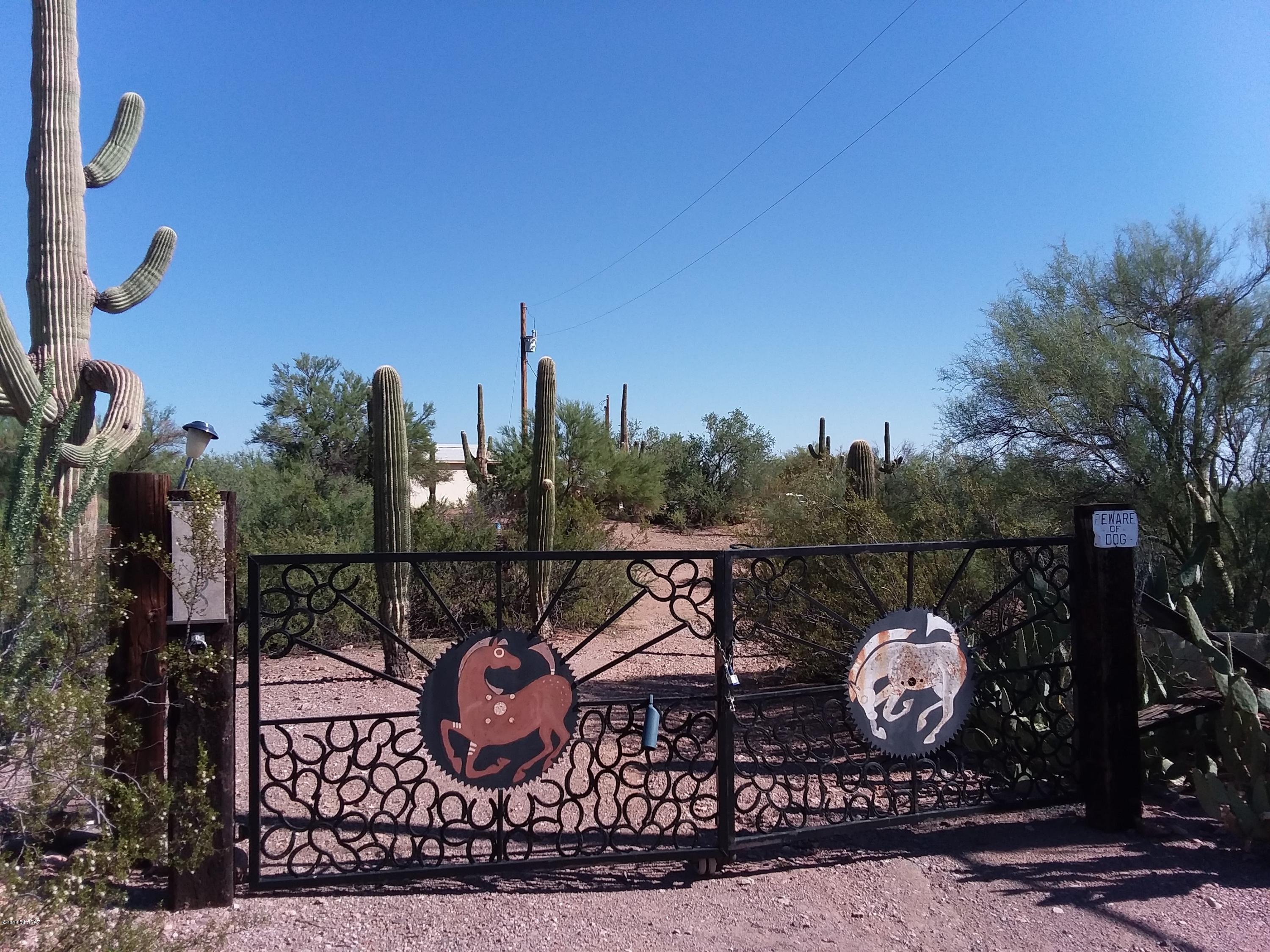 5 acre parcel with mountain views and saguaros. Nice private property with great potential.No Septic has been installed on the property. Water hook up from well share available and electric is available. Seller is willing to subdivide from the 10 acre parcel if only 5 acres is purchased. Site built and manufactured homes allowed. 
Property is in an estate and being sold in AS-IS condition.