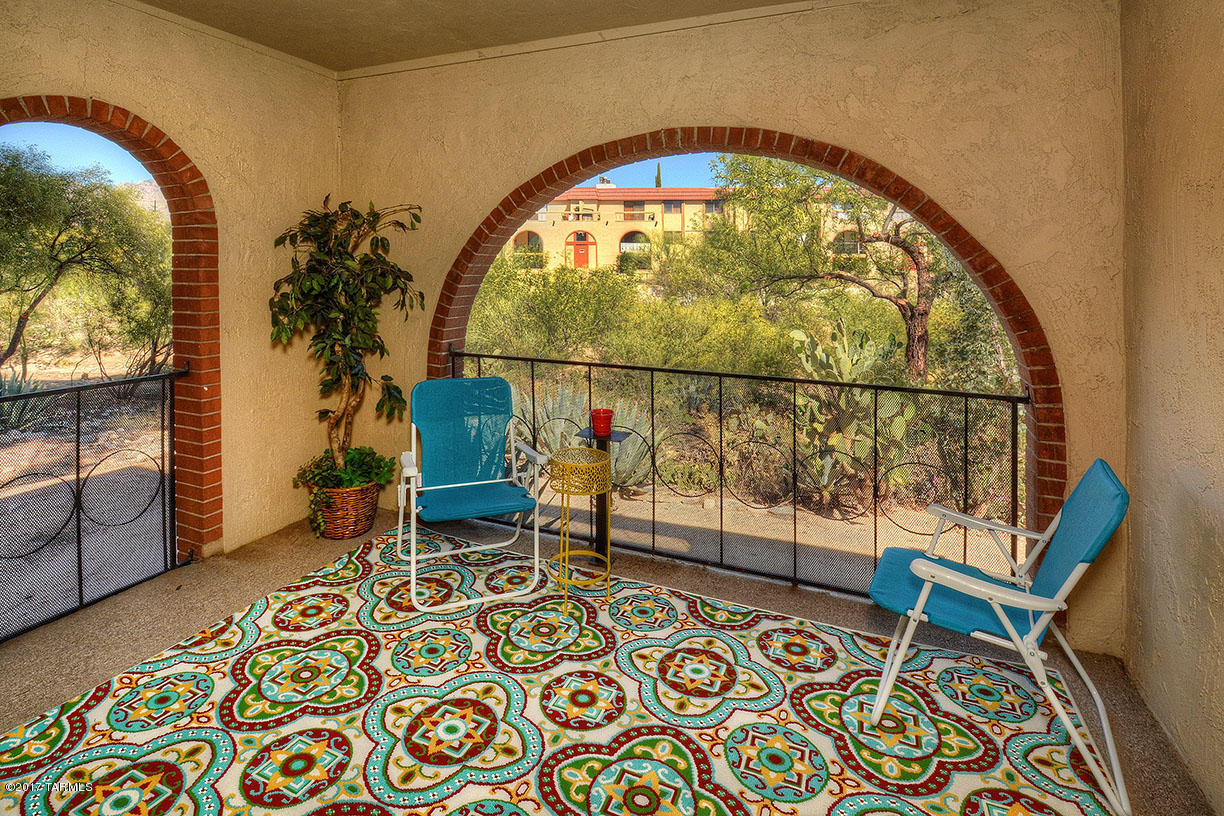 Adorable and Affordable. Relaxing Catalina Mountain and natural desert views from your private balcony. Welcome to Barcelona Manor! Well maintained, middle level. Generous Bedroom, Walk-In Closet with private access to bath. Linen closet, newer tub, fixtures and extra long vanity & mirror grace the bath.  Laundry in Bldg. Ample room for entertaining in dining area. Newer kitchen appliances. Enjoy summer days & nights on patio and 2 community Pools, recreation center, BBQs, walking path, playground. Mature trees, grass. Oracle/Orange Grove area convenient to Quail Canyon Golf, U of A or I-10. Minutes to essentials: post, grocery, bank, hospital, dining.  HOA fees pay water, gas, Pools, termite, garbage, landscape and hallway cleaning and more.  Call your Realtor for a showing today!