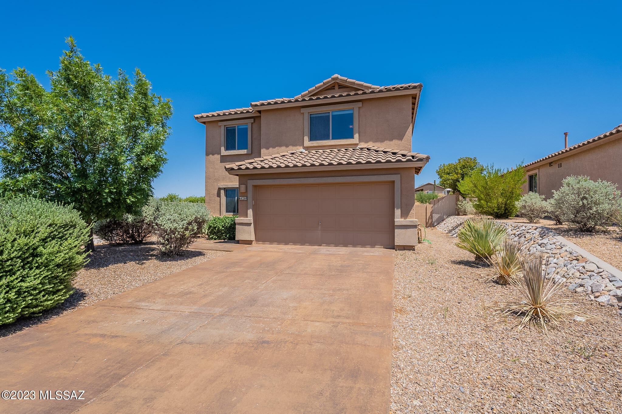 One's home is often thought of as a place of restoration and relaxation, besides simply a place to live the daily activities of one's life. This move-in ready home now available in Eagle Crest is in a calm and quiet corner of Northwest Tucson, with enjoyable views of the Catalina Mountains and no neighbors directly behind the home. With a large fenced backyard overlooking green space and mountains, a variety of spaces to gather and enjoy family and friends, and a nearby park, it's perfect for a family home in a peaceful neighborhood. Bonus: this home is freshly painted, spotless and move-in ready for its new occupants, The kitchen and breakfast room, with plenty of natural light, are open to the main living area and the sliders to the backyard, with room to add garden plantings as desired The family selling this home, who now live nearby as they love the area, enjoyed many evenings with friends and family in this area of the home, entertaining and celebrating events together. The kitchen is equipped with all the needed appliances and a generous pantry. A separate den/office space has double doors and provides either an escape or another gathering spot, as needed. The four bedrooms upstairs are all well-sized, with the primary bedroom having space for a small sitting area and providing delightful views of the Catalina Mountain Range. Just the spot to watch the monsoons roll in! An upstairs loft is generously sized and makes a perfect spot for children to gather and study or watch TV. The laundry is sensibly located upstairs with the bedrooms, so no dragging laundry up and down stairs. Two of the additional bedrooms and the loft also have enticing mountain views. 
The sellers report that neighbors are "friendly but not intrusive". Excellent shopping nearby is provided by Basha's and Dollar General, as well as plentiful local restaurants including many that will deliver to your home. The many restaurants, grocery store shops, personal services, and medical services of Oro Valley, including a large Wal-Mart, are just a few minutes south. Open enrollment is available for local schools. The local kids take the bus around the area, with a bus stop near this home. If this sounds like easy, old-fashioned living in a safe community, it is! You are invited to see this home today.