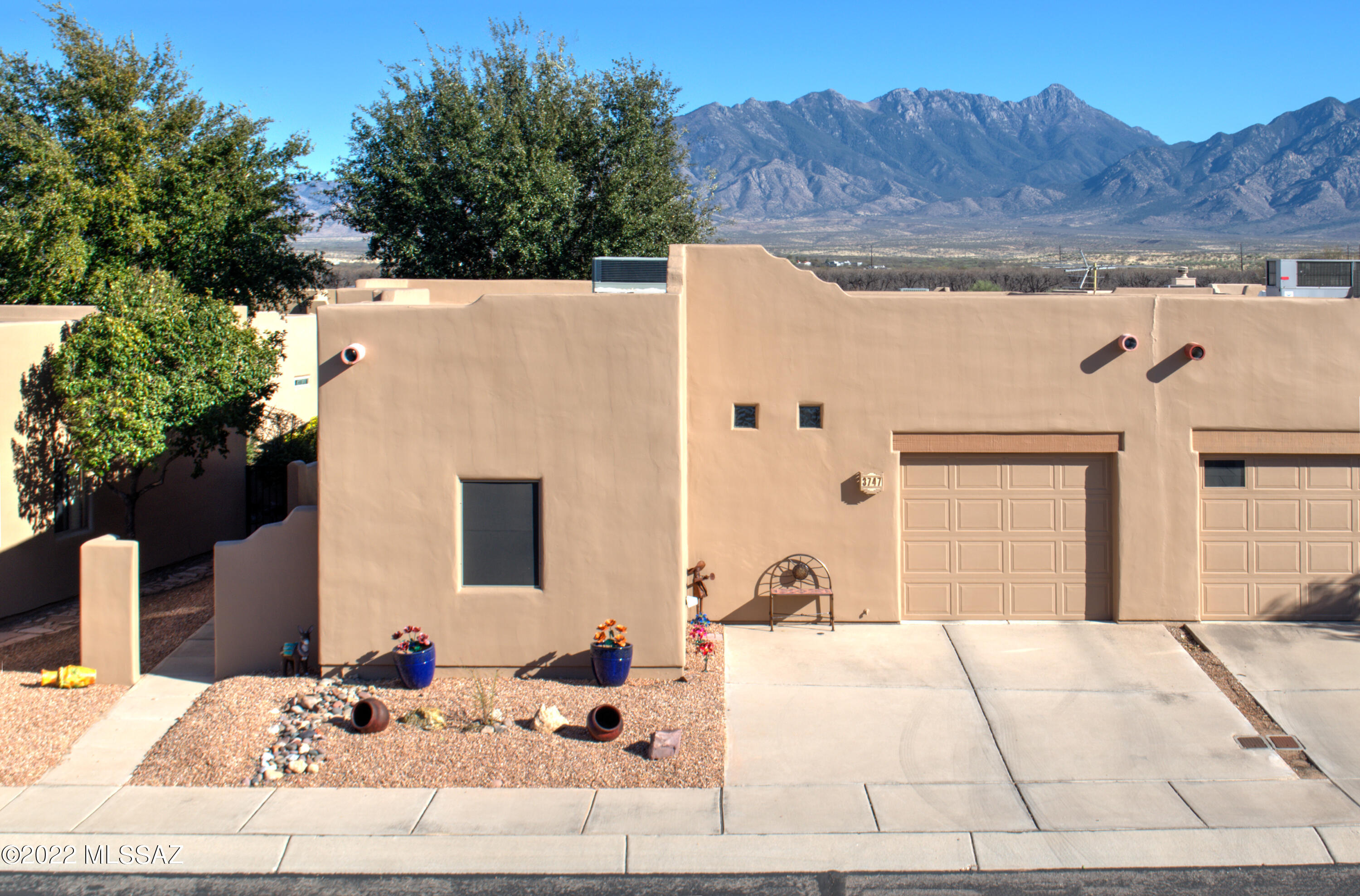 Fully furnished! This immaculately maintained 2-bedroom 2-bath townhome in the Springs at Santa Rita is move-in ready with newer appliances throughout: all major kitchen appliances have been replaced since 2015, your Trane heat pump was installed in 2019, and your water heating and softening systems were installed in 2016. A bonus room provides space for your home office, your covered patio awaits a grill, and the exterior of the home was just painted so you can relax and enjoy! The community features a host of parks and green spaces for residents (we even have a dog park), a mile long nature trail,  and the Santa Rita Springs GVR center is .2 miles from your door. A jewel of a property in a desirable community - this is a must see!