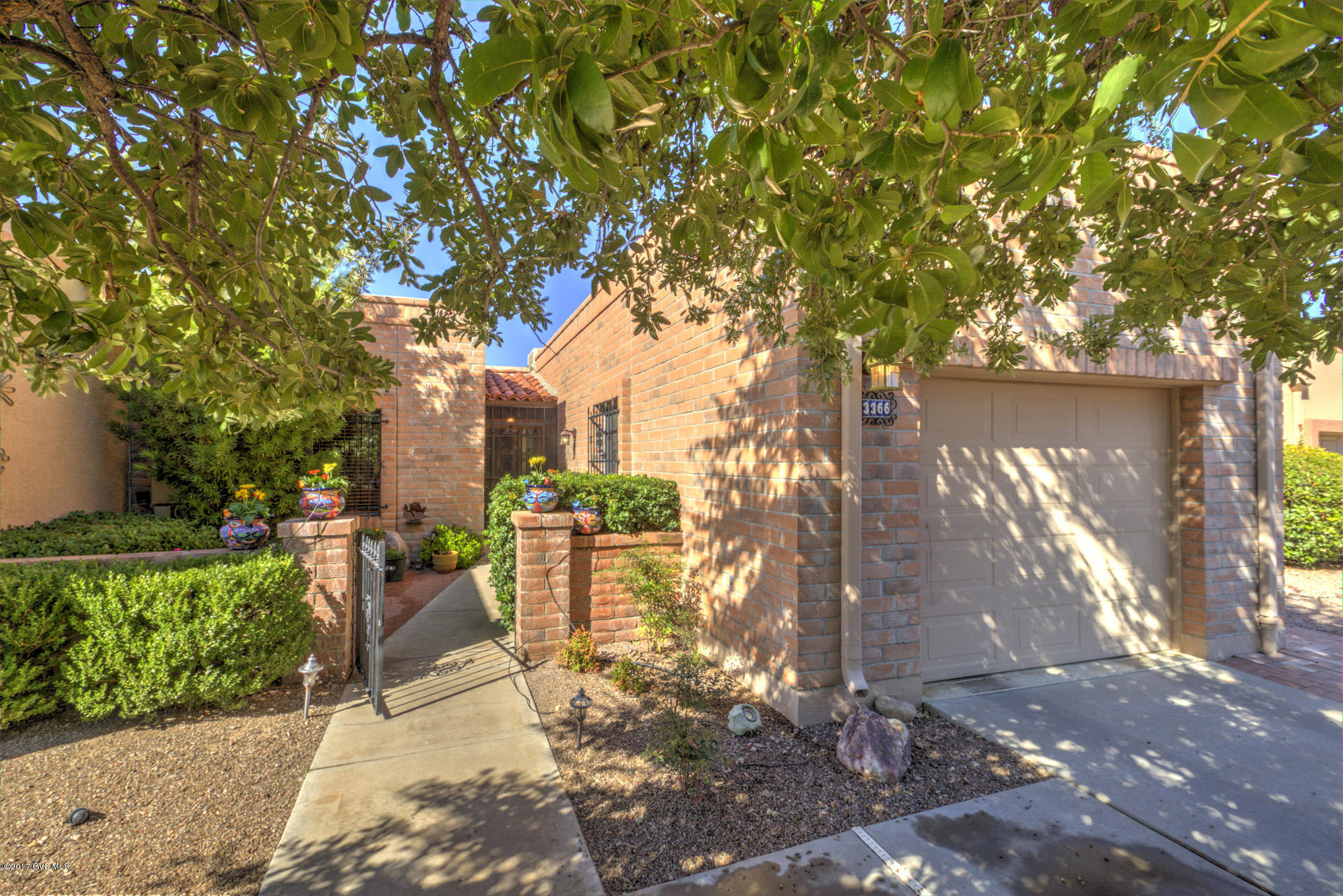 The moment you enter this spectacular Town Home your eyes will immediately see many of the fantastic upgrades the Sellers have preformed. Starting with the kitchen customization from cabinetry, glistening granite, upgraded appliances, spacious pantry, and a beautiful expandable island. Tile flows through through out the entire home. The Living Area flows to the Formal Dinning area. The Master Suite was expanded with custom natural wood crown molding and wood beams, updated sliders, upgraded granite in the Master Ensuite. The Guest Bedroom and bath are spacious, too. The front patio is also private with partial Mountain Views.