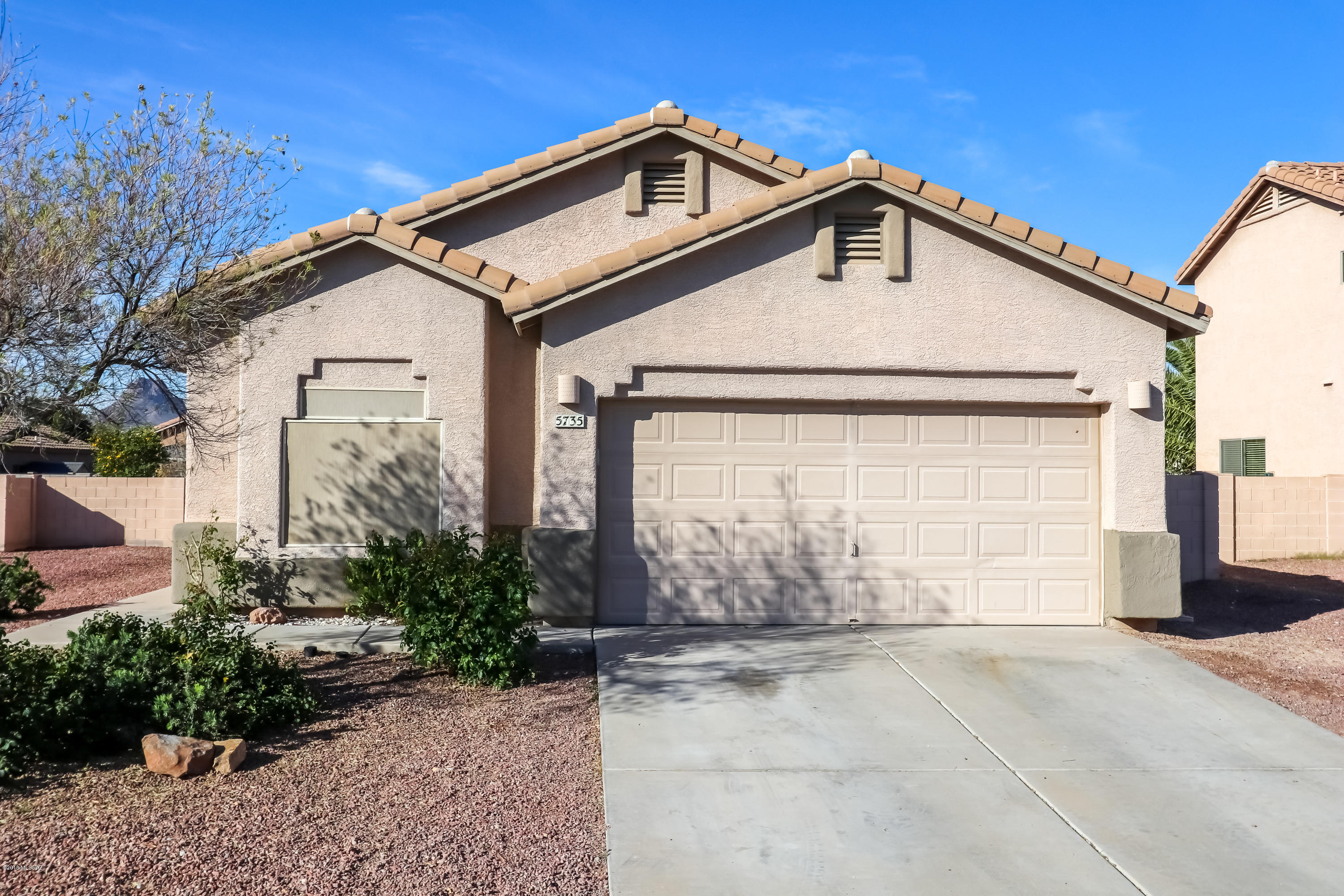 Fresh paint! Fresh carpet! Tile and laminate in all high traffic areas. Vaulted ceilings, large yard with mature citrus trees and a brick paver patio area. Large master with dual sinks in the master bath, separate tub, and shower with huge walk-in closet. Hurry! This one won't last long.
