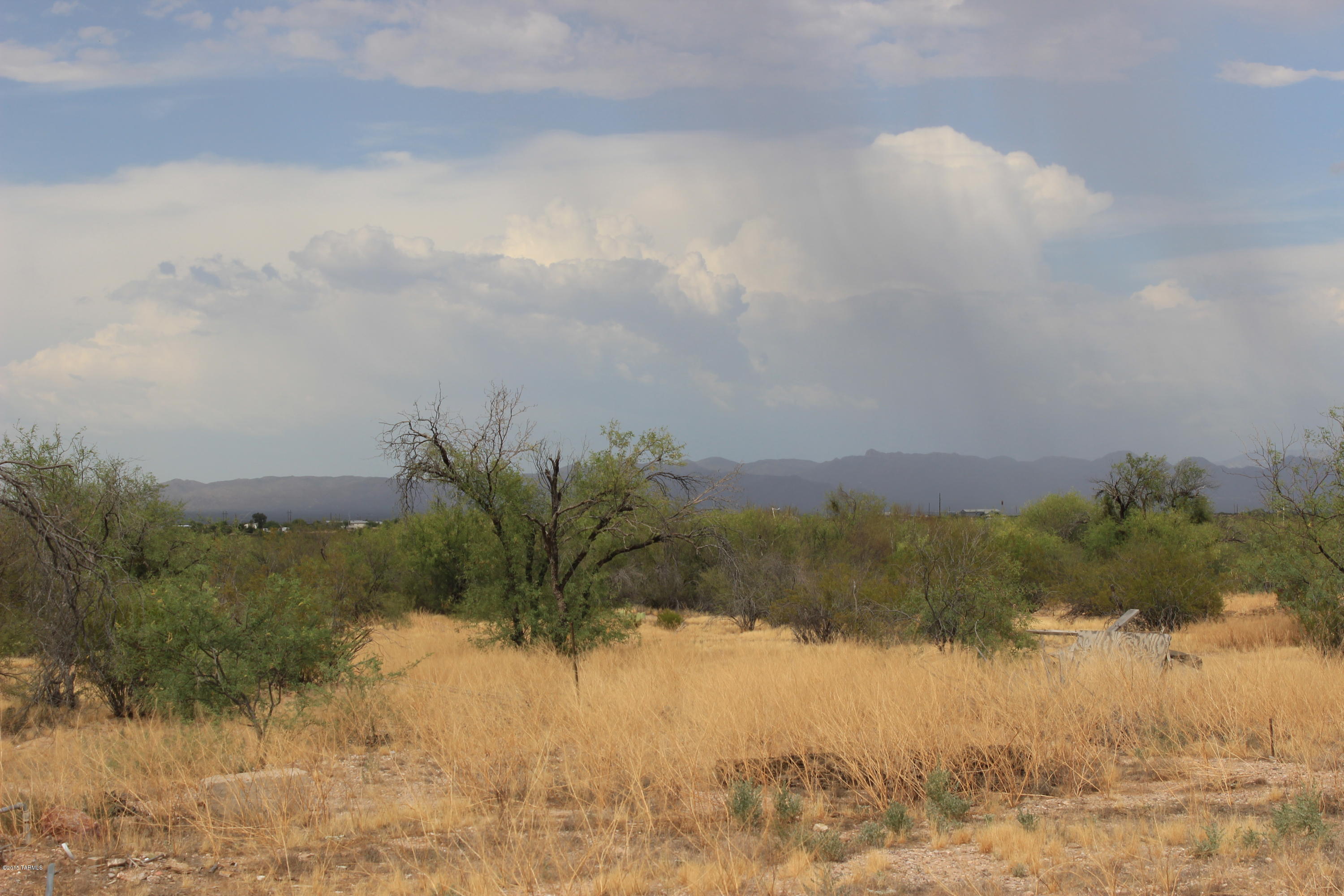 A picturesque acre of Marana horse property. Sweeping mountain vistas. Manufactured home that had been here was removed years ago. Utilities had extended to the home site.