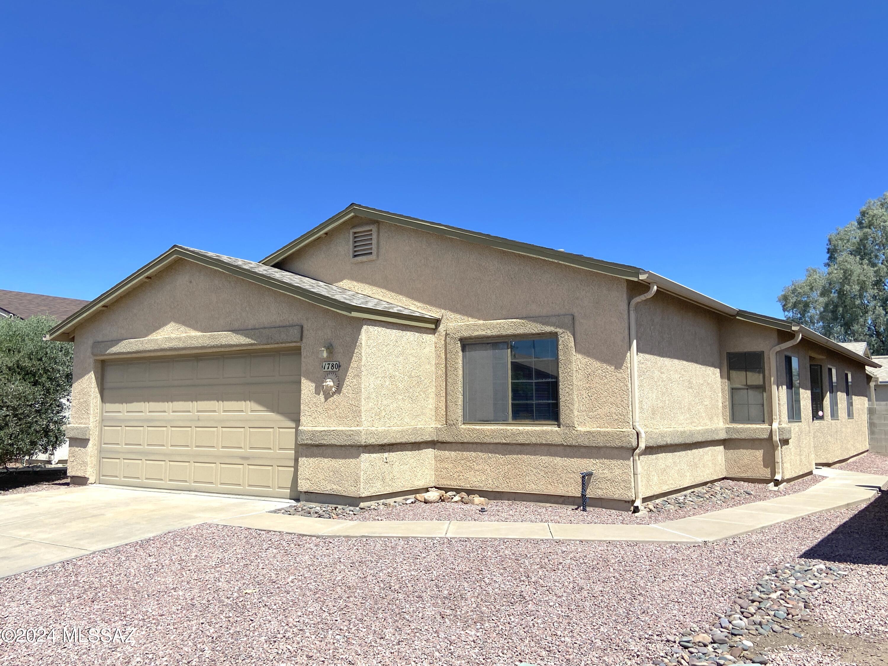 Looking for a home with potential in a prime location? Located in desirable Midvale Park in Southwest Tucson. This property features 4 bedrooms, 2 bathrooms and 1,533 sq ft. Roof is 2 years old and new gravel just installed.  Featuring North/South exposure and a opportunity to make this home your own.  Yes, the home needs some TLC and remodeling. Great opportunity for some sweat equity and make this home shine brighter than ever. Large living room with vaulted ceilings. Primary bedroom with walk in closet and private bath. Fully fenced backyard with covered patio. Two car garage with storage. Great location with easy access to I-19 / I-10 and is conveniently located near shopping, restaurants and entertainment.