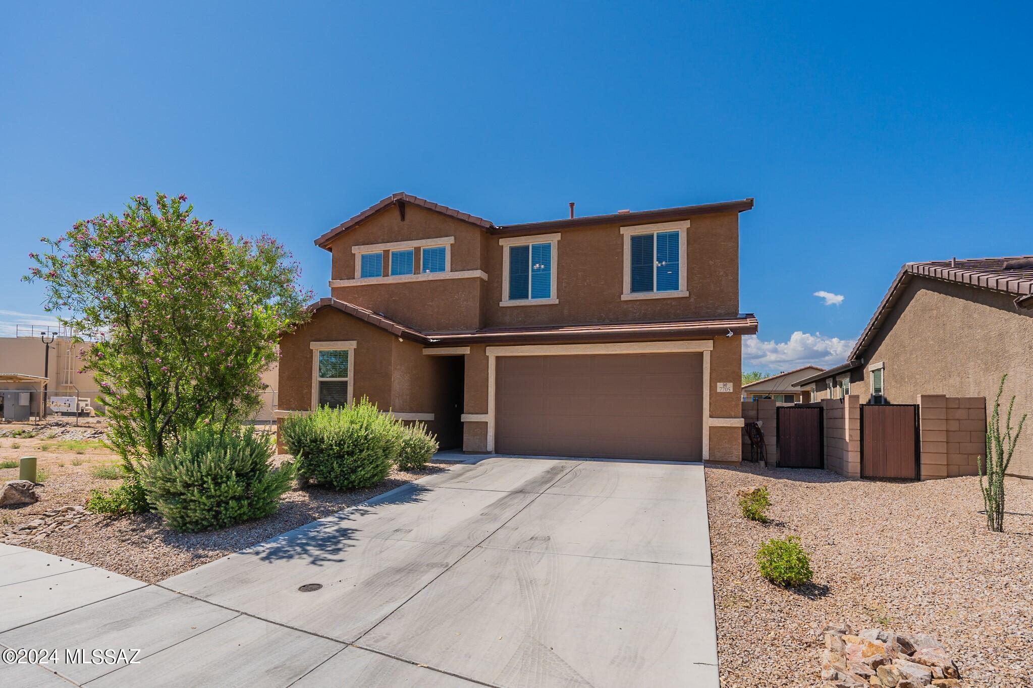 Gorgeous Richmond American built,3 Bedroom 2.5 Bath 2367 Sq Ft home in growing SW Tucson! Curb appeal greets this Pearl floor plan through an attractive entryway leading you into this AMAZING HOME. Large living room, spacious dining area, a beautiful open kitchen with island. Large half bath & BONUS Den/Office downstairs. Upstairs includes a BONUS loft area with 2 generous-sized guest bedrooms, a big full guest bath, a master suite, a large master bath, convenient dual sinks, and a nice walk-in shower. Beautiful backyard with no neighbors behind, generous space between homes. quiet subdivision & street. BONUS FEATURES include a water softener and newer A/C ! Come See Today!