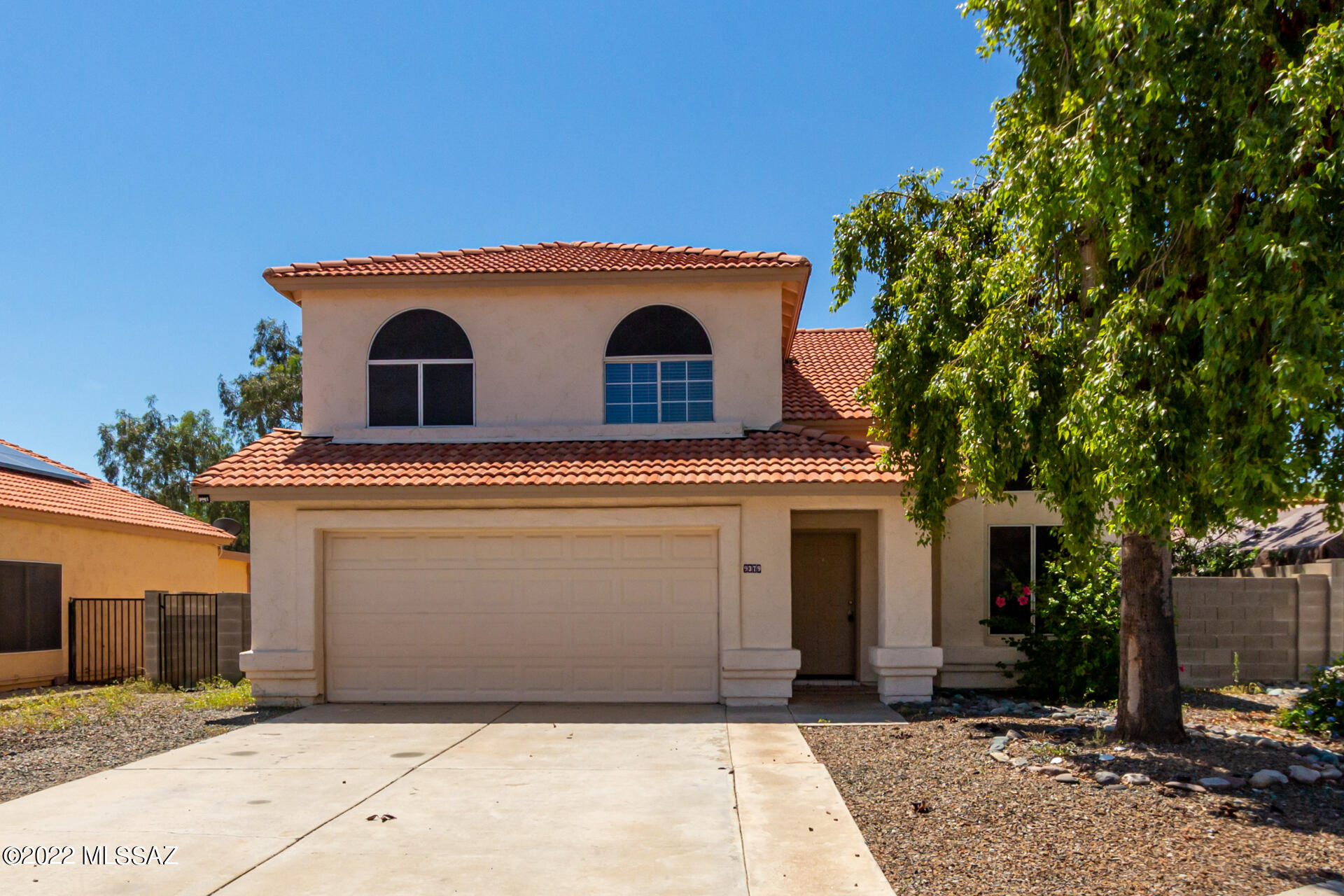 Looking for a place to call home with no HOA? This is your chance to own this adorable two-story home nestled on a cul-de-sac lot in Tucson! Upon arrival, you will be greeted with a lovely facade, mature shade tree, and a low-care landscape. Discover a delightful interior featuring neutral tile flooring, soothing palette, and a spacious living/dining room w/vaulted ceiling. The great room showcases a media niche & an inviting fireplace to keep you toasty warm in cold winters. Chef-like kitchen boasts white cabinets, mosaic backsplash, granite counters, SS appliances, and a pantry. Carpeted primary bedroom has a walk-in closet & an on-suite w/dual sinks. The serene backyard provides a relaxing covered patio and artificial turf. AC replaced in 2019! Don't miss it! Schedule a tour today!
