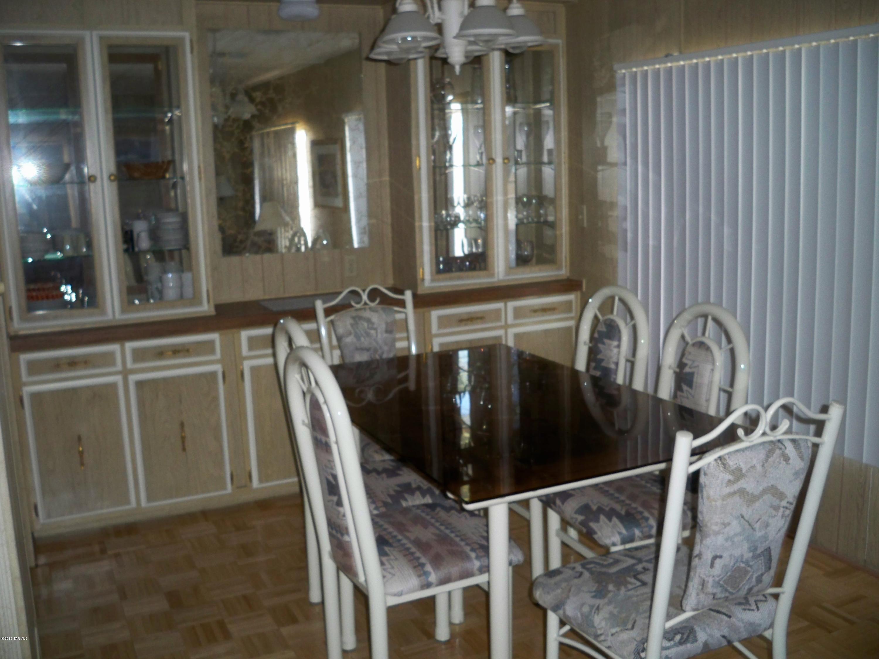 Large lot with Mt views/Furnished Move In Ready Home with central A/C.  Located in a 55 plus community--Enjoy golfing-putting green-pools-therapeutic pool-Rec center-paved roads W/street lights/ variety of businesses near by. Enjoy all this for the monthly association fee.