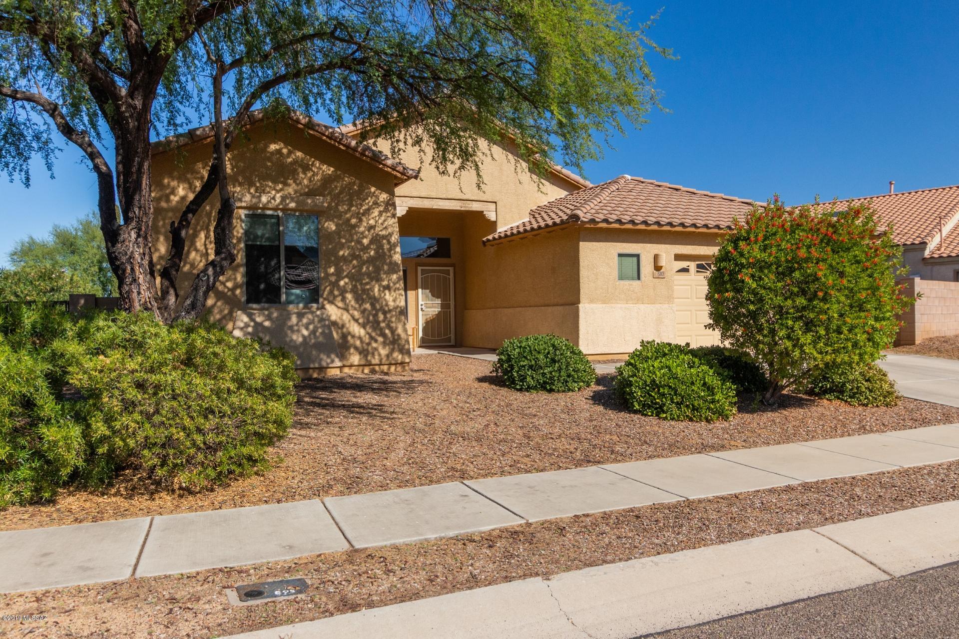 Beautiful move in ready home available on a corner lot in highly sought after Black Horse Ranch. Excellent location, just minutes from schools, parks, shopping and restaurants. Ideal floorplan offers nearly 2000 sq ft of living space, 3 generously sized bedrooms and a spacious greatroom, perfect for entertaining. Stylish open concept kitchen has it all with granite countertops, maple cabinetry, a sunny dining nook and an island with breakfast bar seating. Large master bedroom includes his and hers walk in closets and a private ensuite with dual sinks and a separate tub and shower. Lovely backyard offers a covered patio, a nice green grassy area, a great spot to slow down and savor the Sonoran sunshine! Act fast and make this your dream home today.