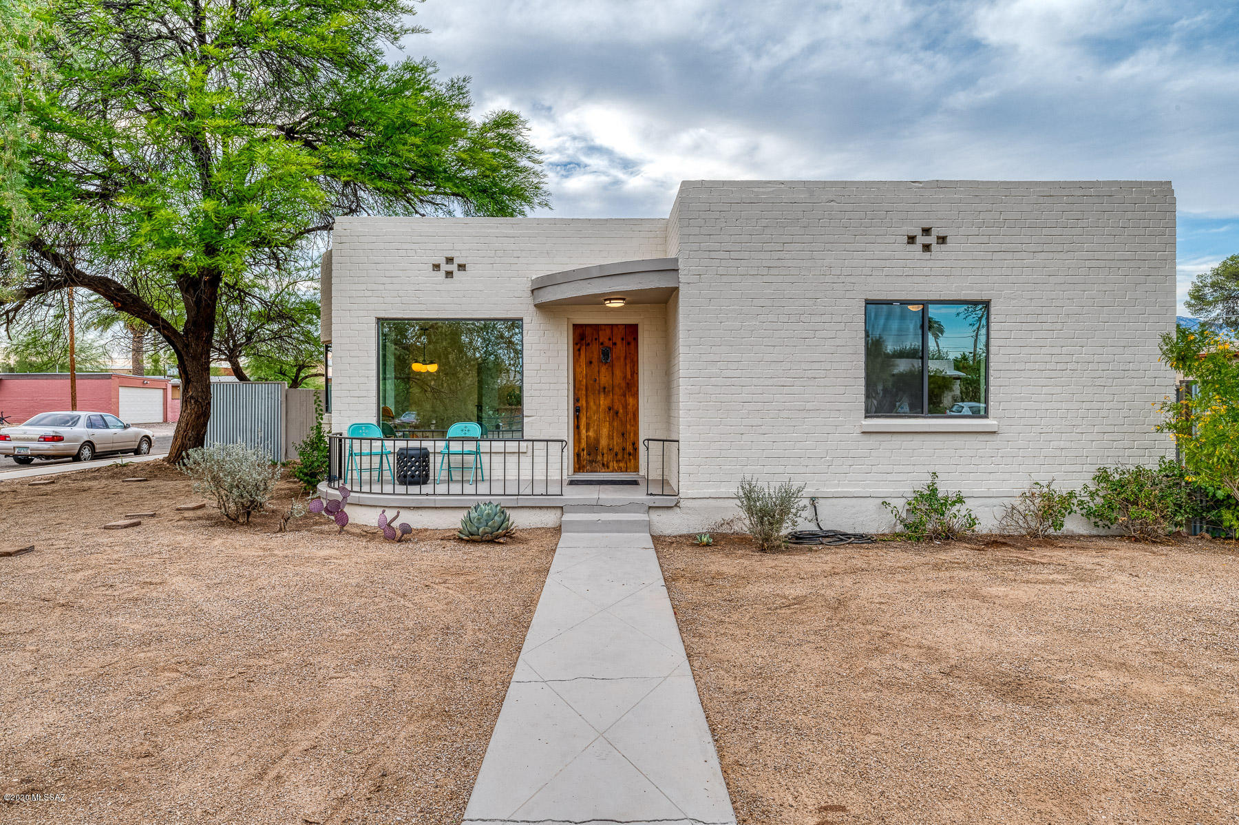 Fantastic fully remodeled two bedroom one bath plus DEN. All new roof, HVAC system and ducting, Insulation, plumbing and electrical wiring by licensed contractors. Beautifully restored hardwood floors, American made solid wood cabinetry and quartz counters. Wonderful mud/laundry room off kitchen. Close proximity to the UofA and many great restaurants and shops. Owner/Agent