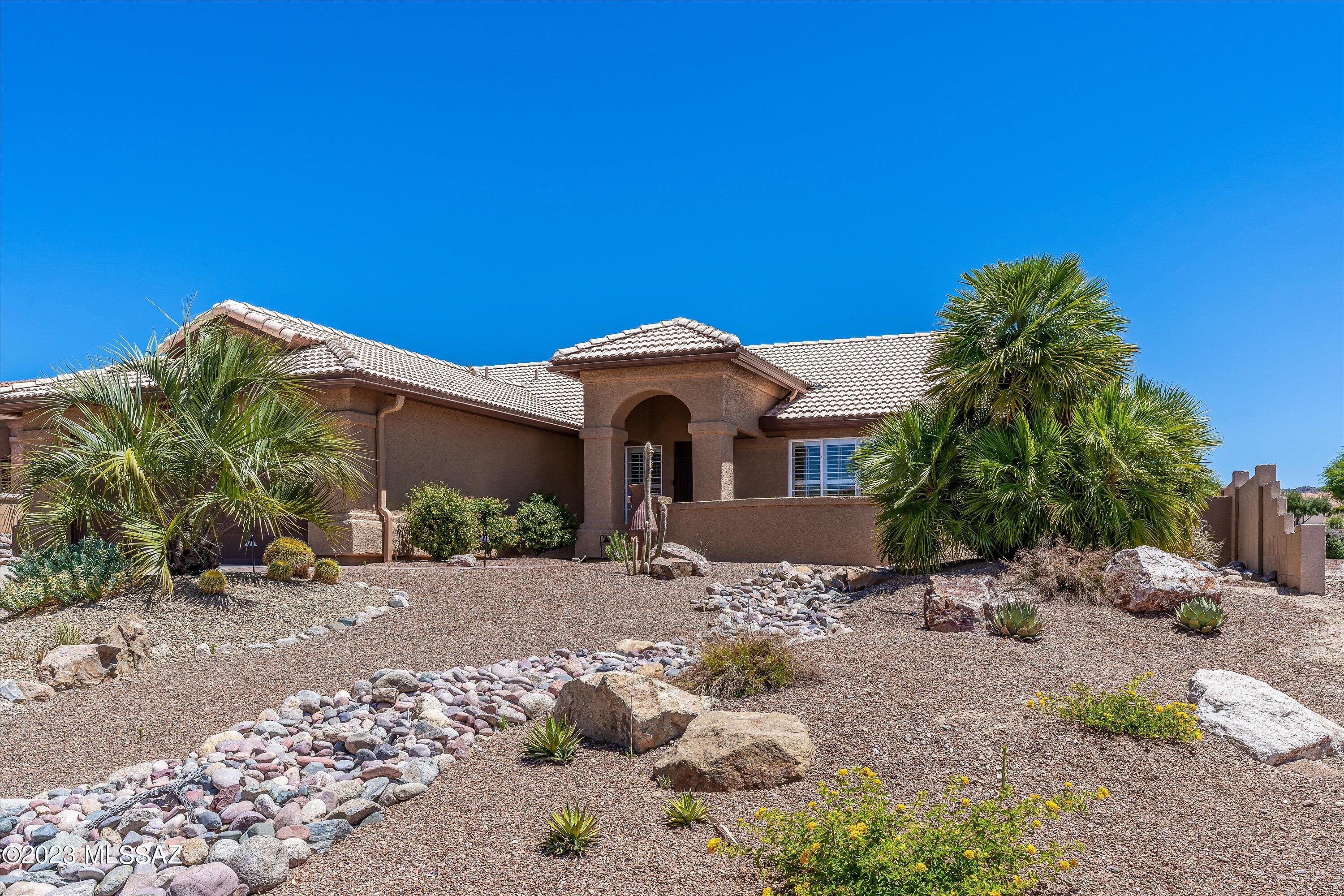 Sited on a corner lot, this updated Diego model featuring 2 Bedrooms and 2 Baths is waiting for new owners. The entry patio has mountain views and leads you into the welcoming gathering room. The kitchen has Stonite counters, stainless appliances and is open to the nook and spacious family room. The Owner's suite has slider to patio and backyard plus upgraded en-suite with two closets. Your guests will enjoy the guest room and bath.  The spacious laundry room can double as a hobby room. Whether entertaining or simply enjoying the SaddleBrooke lifestyle the attached Arizona room and nicely landscaped backyard with side mountain views is ideal. Come and see this special home today.