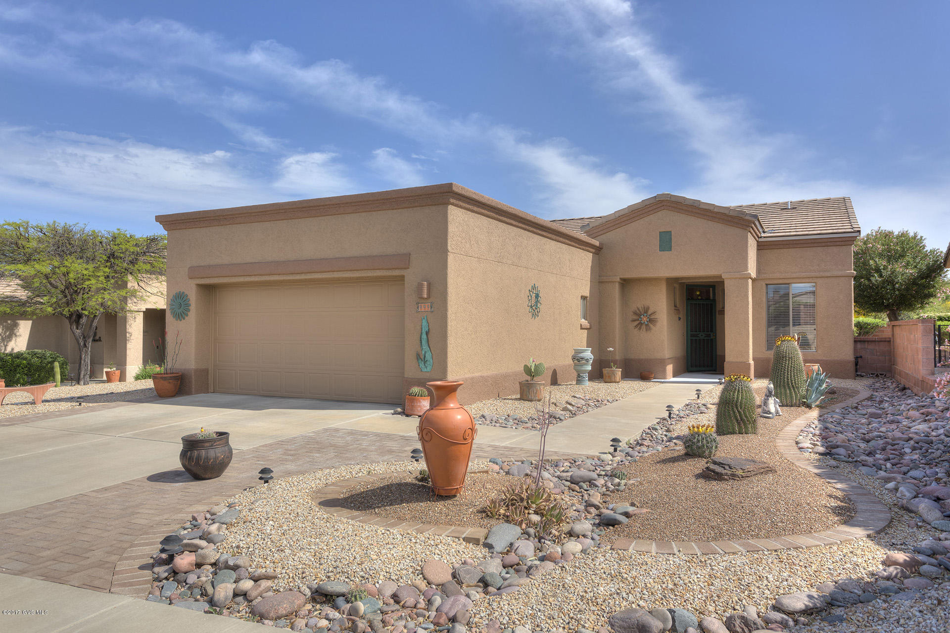 Great views of the Santa Ritas from the moment you walk in the front door and from the kitchen, dining area, great rm, master bedrm and the side and back covered patios. 2 bedrms, den, open great room with an extended two car garage. Large ''L'' shaped extended patio with a good size private walled backyard. Tile on the window sills, higher toilets, new garbage disposal, Exterior Painted 2016, new water heater 2014, Roof work 2017, large shower, newer flooring, great rm windows replaced with plate glass for the view. Great Storage.