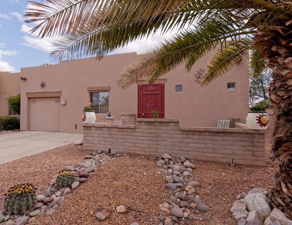 Hello! This might be what you have been looking for. Nice 2 bedroom it bedroom plan), 2 baths and end unit townhouse located in The Springs. Close to one of Green Valley's nicest Recreation Centers. Features include easy care tile floors throughout, fireplace in living room, huge walk in closet in master BR. Back patio includes Kiva fireplace for those cool evenings while you enjoy the great outdoors. Front courtyard allows for views of the great common area across the street. 1 car garage. GVR membership required. Great full time home, winter retreat or rental.