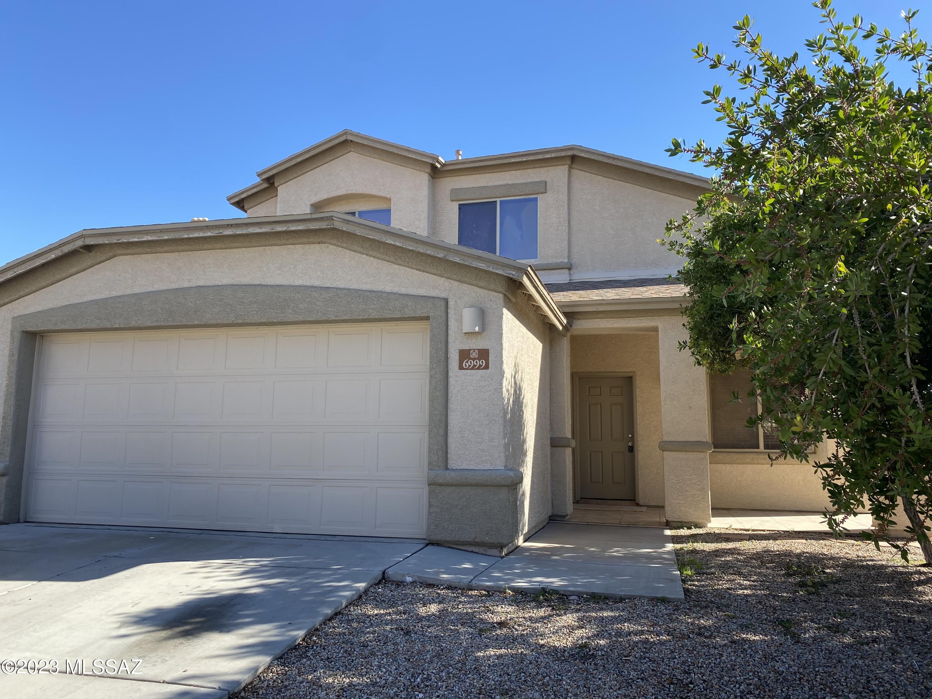 Don't miss this 2-story 4 Bedroom, 3 bath home with a plenty room for the family! High vaulted ceilings accentuate the bright, open floor plan of the home. AC cooling plus ceiling fans. The large kitchen has a large island, plenty of counter top and cabinet space, and is equipped with a refrigerator, stove, dishwasher, and microwave. The large primary bedroom has a spacious walk in closet. Washer and dryer hookups, 2 car garage, and a walled yard with patio complete this home. This home is located close to shopping, schools, downtown and has easy access to I-19 and the I-10. Get out of the hustle of city living and into the serene and peaceful setting of this quiet neighborhood.

Tenant pays all utilities.
Sorry, no pets allowed.