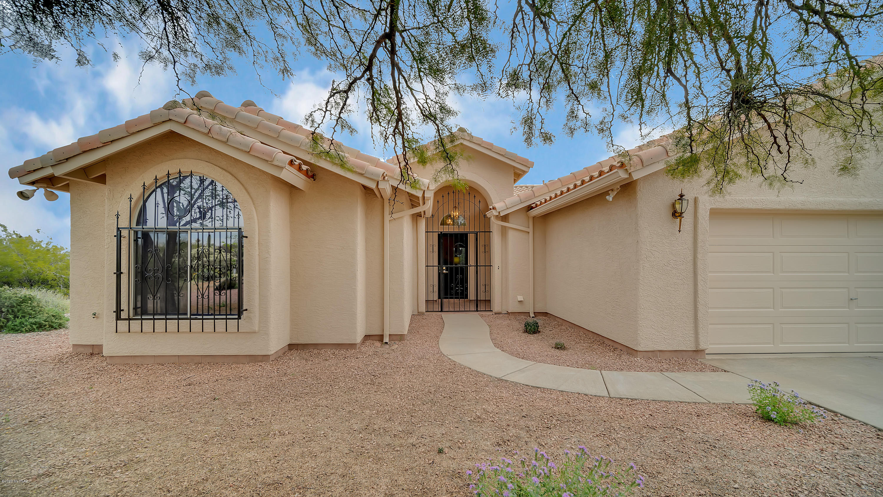 Beautiful home with a sparkling pool and spa set on a private acre lot in Rancho Buena Vista. Soaring ceilings greet you as you enter the front door into the expansive great room including, a dining area. The kitchen has a plethora of cabinet space with a breakfast bar and kitchen nook.  Enjoy doing dishes while looking over the natural desert landscape from the kitchen sink window.   Tile flooring leads you to the guest bedroom at the front of the home with a conveniently located, adjacent full bath.  The study or den has double doors for added privacy or a more open feel. The master bedroom has vaulted ceilings, a large master bath with walk in shower, spacious walk in closet, and  a sliding glass door providing access to the fully screened back patio. The sparkling pool is sure to please, as well as the spa, to help relax and enjoy the sounds and scenery of the Sonoran desert.