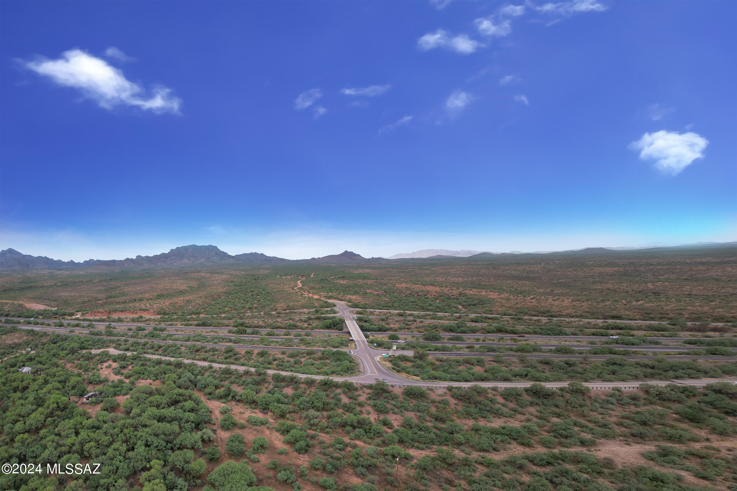 Seize the chance to develop across 610 acres at Salcido Ranch, strategically located at the I-19 Exit 42 interstate exchange in the Tubac-Amado area. This property boasts 27 acres of land adjacent and visible from 1-19 with M-1 zoning, offering a wide range of possibilities, including industrial, commercial, agricultural, and residential development.
With a dedicated highway exit making entry onto/from I-19 easy and the convenience of being just north of the Border Patrol Inspection station, travel is made hassle-free for those heading north. The M-1 zoning allows for light industrial uses as well as commercial ventures under B-1 and B-2 zoning. Additionally, there's potential for county-approved expansion of the M-1 zone. In addition to the 27 net usable acres, 583 additional acres are available for development, zoned G-R (General Rural), opening even more possibilities for residential, agricultural, and rural development. Water will not be an issue for development with 2 registered exempt commercial wells, 7 adjudicated domestic wells, and one stock pond.
Located just 30 miles from Tucson and 30 miles north of the Nogales, AZ-Mexico border, Salcido Ranch is perfectly positioned for those looking to capitalize on cross-border commerce. It's also an ideal location for agricultural uses, including medical marijuana cultivation and dispensary operations.
Possible Uses for Salcido Ranch Include:
Mixed-use residential and commercial developments
Light industrial park with warehouses or manufacturing facilities
Commercial development, including retail centers or office spaces
Agricultural ventures, including medical marijuana cultivation and dispensaries
Large-scale residential development across the additional 527 G-R zoned acres
RV park or truck stop due to excellent highway frontage and accessibility
Private estate or ranch
Logistics hub for cross-border commerce and transportation services
Sustainable development or eco-friendly projects
Whether you're a developer, investor, or visionary, this property presents a remarkable opportunity to create something extraordinary in the Arizona desert. With over 600+ acres of versatile land and prime highway access, the potential is limitless.