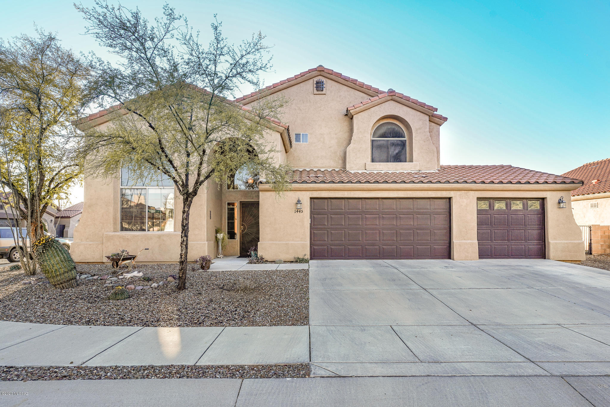 It's all about the views! Truly spectacular views, an outdoor space for Arizona lifestyle with a well placed pool, spa and outdoor bar with many wonderful sitting areas throughout the yard, a sweet retreat in the secret garden beyond the arch of wonderful green shrubbery. The home features 5 bd/3ba, spacious but warm formal and great room(with fireplace) off kitchen boast incredible vaulted ceilings and multitude of windows. The kitchen features granite counter, large island, large pantry off hall with plenty of storage. The master bath is definitely a treat, large open space with tub located with the best view in the house with large closets. The patio off the master has a magical view of the Az Mountains. The third car garage features a very large workbench. Too much to mention