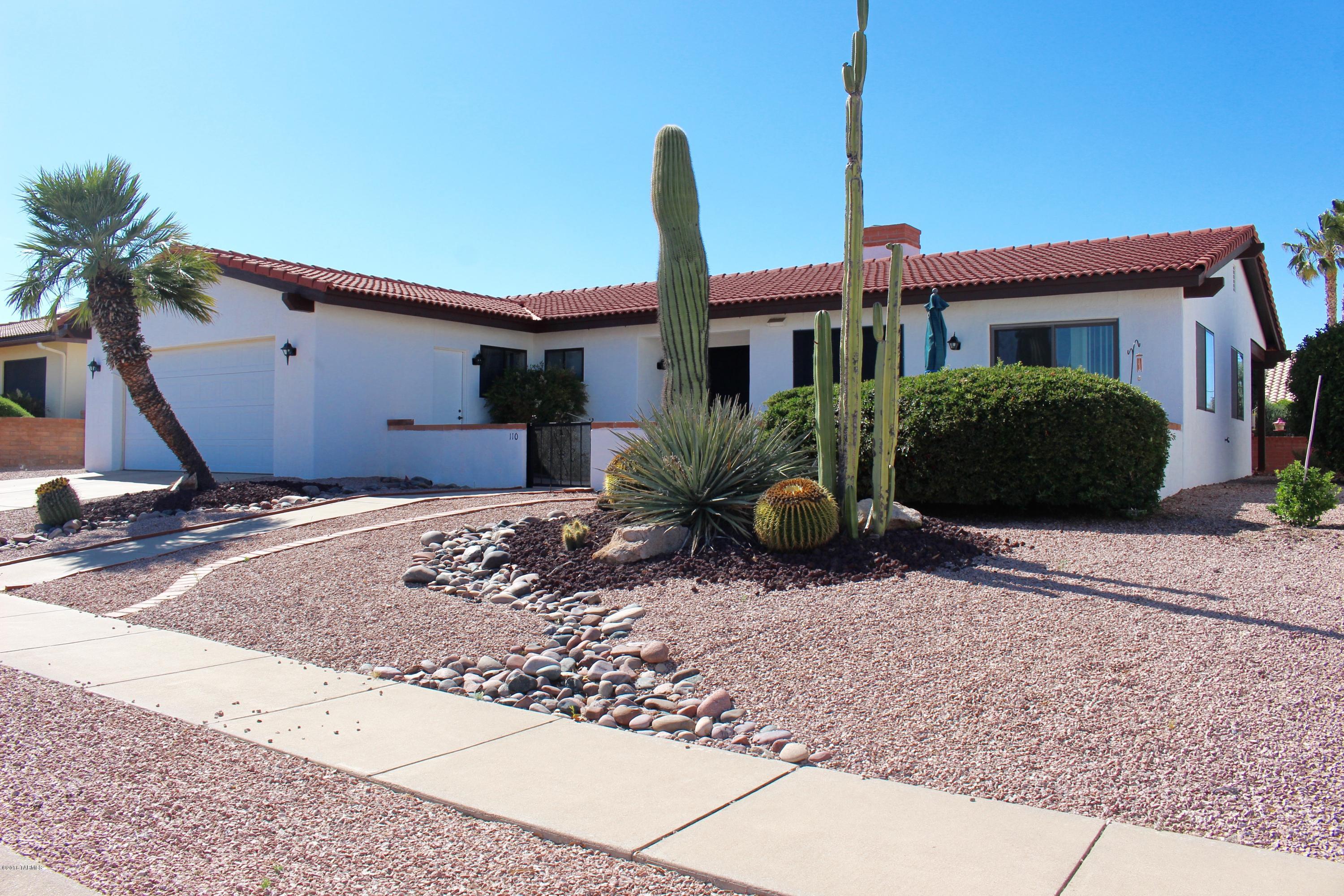 Great location in Country Club Vistas offers easy access to I-19. Tile roof, exterior paint in 2015, new exterior lighting in the front, large lot with mature easy care landscaping, extended 2 car garage with a workbench for him, charming front courtyard with limited Mountain views, ceiling fans through out, newer hot water heater and furnace, updated kitchen appliances, Southside ''Anderson'' sliding glass door with low E glass, dual vanities and step-in shower in Master. Well maintained home, just a cut above the rest.