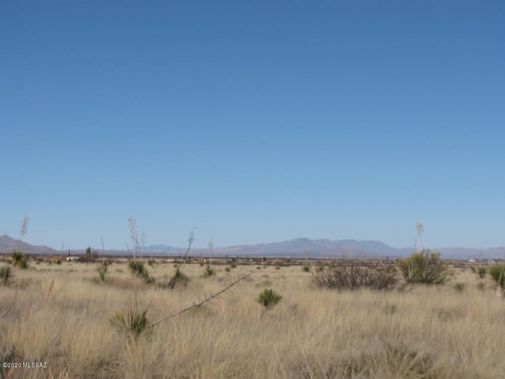 Approx 2.14 ACRE total.  TWO tax parcels, each are approx 1.07 acre.  Nice level building site with plenty of room to bring the horses or livestock.  Fabulous panoramic views!  Coronado National Forest is only 1/2 mile away.  You can ride your horse or hike forever.  Only a couple of neighbors in the area but still considered remote and private!