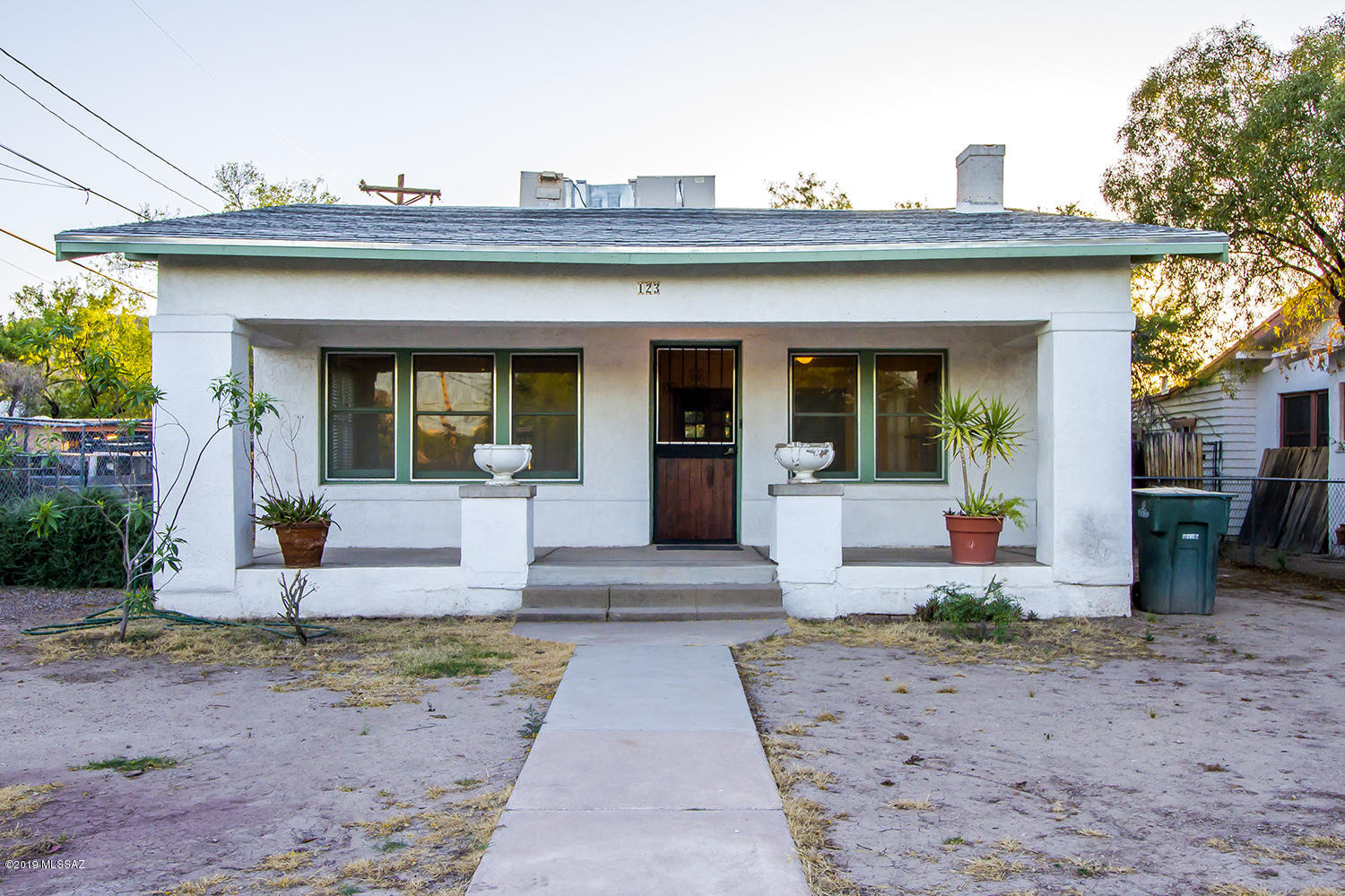 Over $15,000 price drop!! Super charming 1920' s Craftsman 2/1 main house and 2/1 bedroom guest house in Menlo Park. Live in one house and rent the other!  Main house features brand new HVAC(2019),coved ceilings, original hardwood floors throughout , updated bedroom with vintage style tile, lovely period built -ins and beautiful fireplace. This house has been lovingly cared for by owners for many years, Fully gated and fenced backyards with large carport with storage and laundry room. Fully permitted guest house (built in1993 )  includes 2/1 house with AC and spacious kitchen and large bedrooms. The guest house has a separate laundry room, carport , storage and fully gated large yard . Close to Mercado , A Mountain, Downtown, U of A, I-10 .