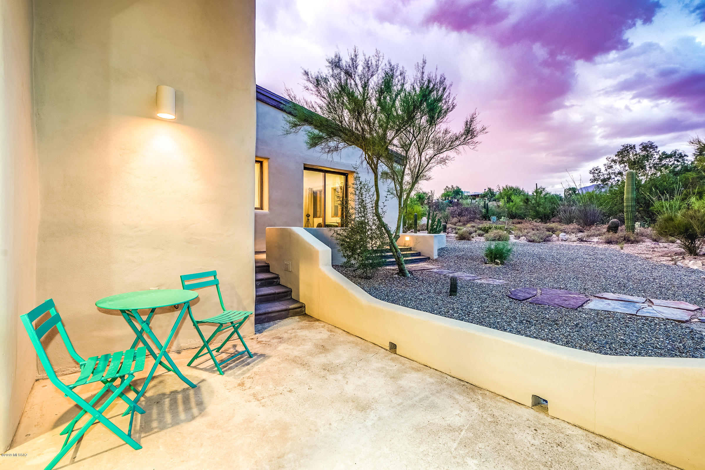 The Shrigley house is a modern, mud adobe, custom home built on 2.2 acres in Catalina Foothills Estates.  The 2 bedroom/ 3 bathroom home was built for Edward Shrigley (Noted Geneticist and Doctor) and his wife, Marjorie, and was constructed with energy and water conservation in mind.  The home has been lovingly refreshed over the past two years with a focus on keeping the original spirit intact.  Main features include vaulted ceilings, exquisite concrete tile floors, a north-south orientation with two-foot thick adobe walls, Pella casement windows and four separate patios. Kitchen remodel was recently completed and includes quartz counters, new appliances including an induction cook top, and polished concrete floor. This home is ideal for an owner who desires something beautiful & unique.