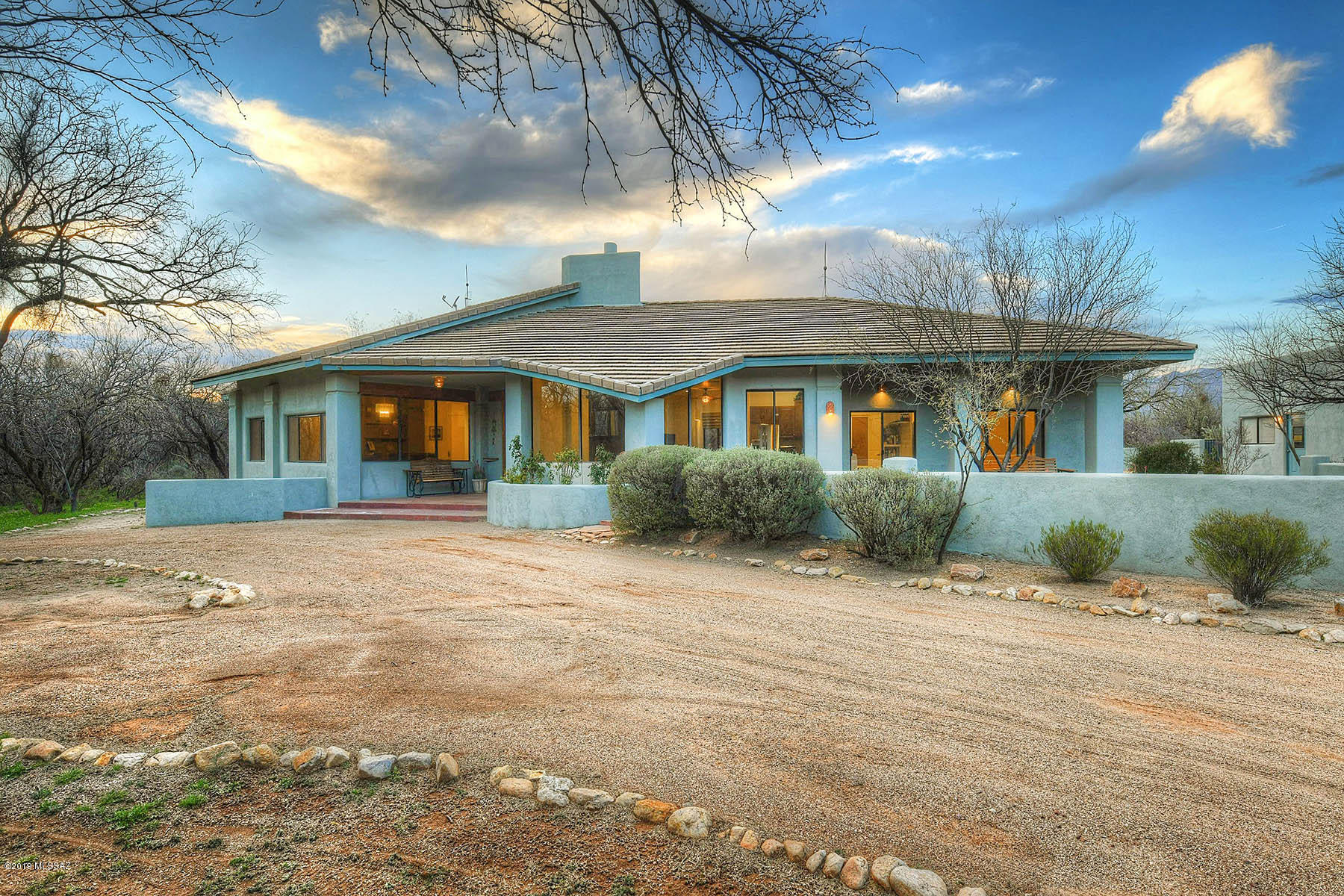 Beautifully updated home on a secluded 3.82 acres of horse property surrounded by the Catalina's and Rincon's, that allows you to enjoy the stunning views from your backyard oasis or your private front courtyard. As you enter your property you will love the large circular driveway and over-sized 3 car garage. This home has an incredible open floor plan that includes a large bonus room room complete with a wet bar and backyard access. Enjoy the fabulous kitchen as you cook on your viking stove and then retreat to your beautiful yard complete with a pool and putting green, and built-in bbq.  Secluded, peaceful and quiet, this can be your desert retreat.
