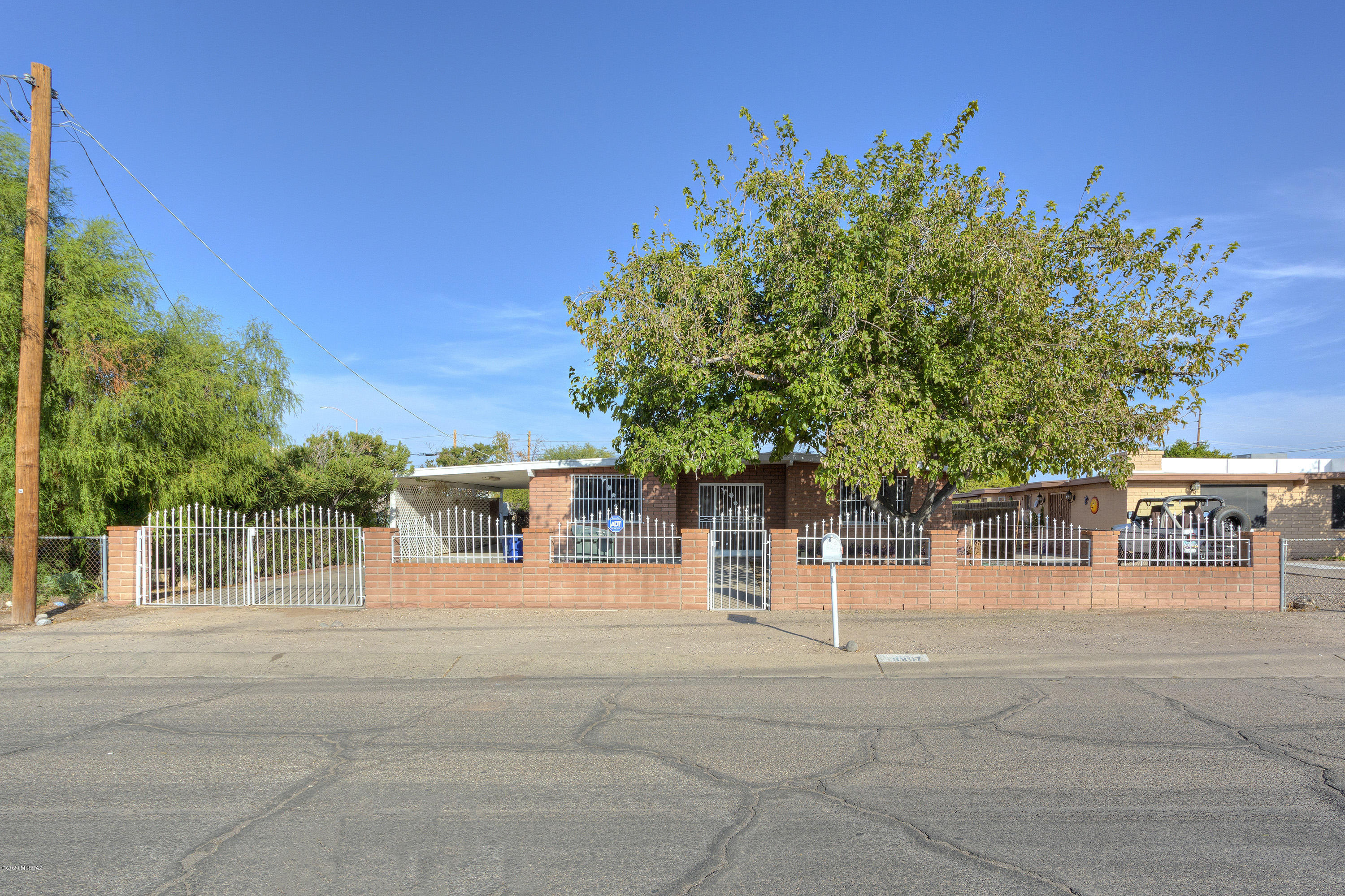 Lovely updated 3BD/2BA brick ranch is very well priced, great family home. Large living room/dining area, spacious kitchen w/plenty of cabinet space, breakfast bar & pantry, all appliances stay.  Master suite features large walk in closet. Jetted tub in hall bath.1BD detached casita w/full bath & kitchen, heating & 
A/C. Storage bldg/workshop w/electric (approx 250 sq ft). Low maintenance encl backyard w/pavers & built in kitchenette/grill, perfect for entertaining! 2 car carport w/extra paved parking area, gated entry. No HOA, low taxes. Convenient to schools,  transportation, DMAFB, Raytheon & I-10.  Come and take a look today before it's gone!