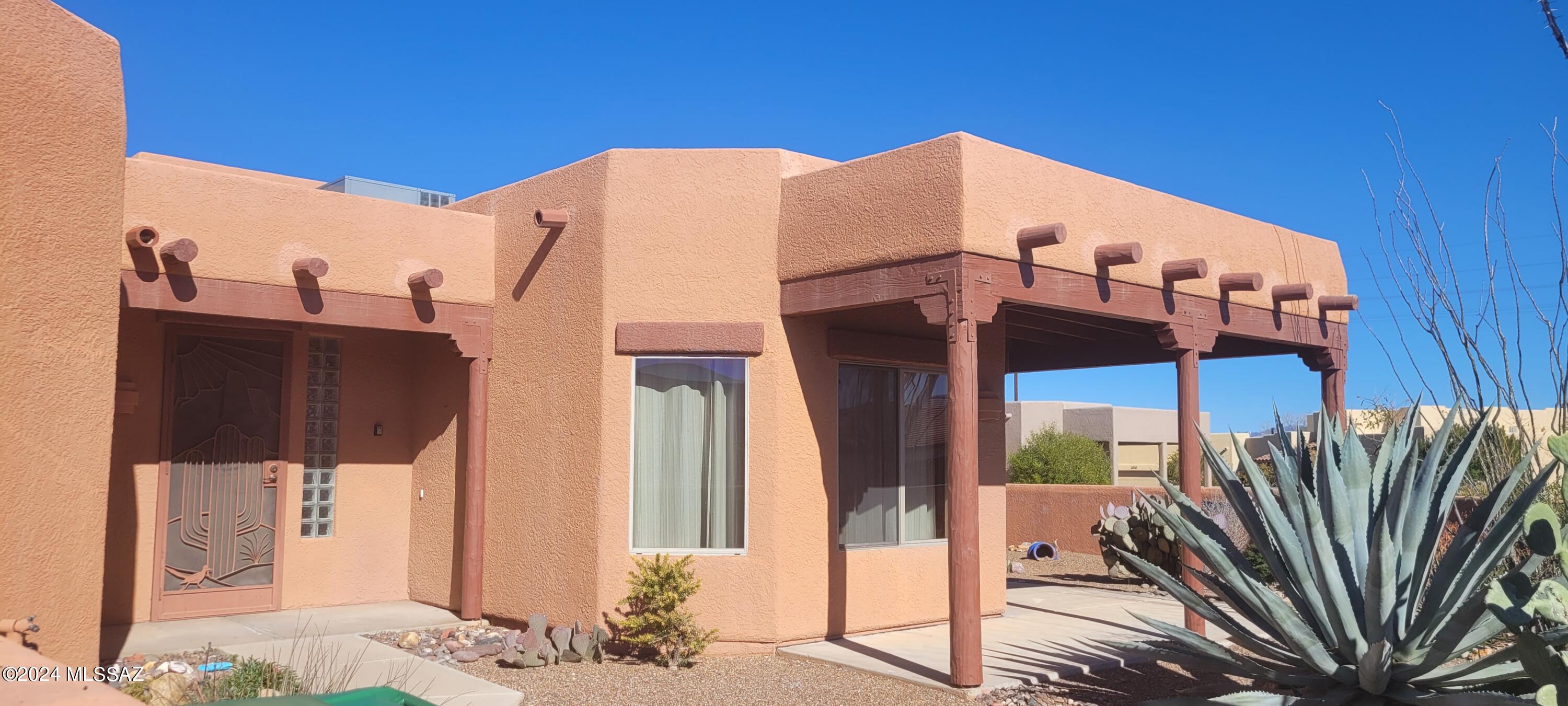 Looking for your perfect retirement home?  This southwestern charmer offers a fully tiled open-concept kitchen/living area with cathedral ceilings, a beehive fireplace, and beautiful mountain views!  Outside boasts an oversized lot with desert plantings and a covered patio.  
Great neighborhood, close to amenities and already enrolled in Green Valley recreation.  The original owners have taken great care of this property and now it can be yours.