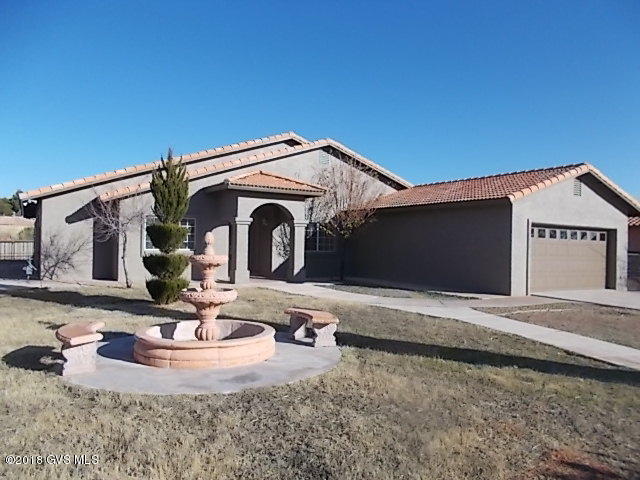 Move up to the right address, Meadow Hills. This executive residence has just been redecorated and the exterior repainted! The new appliances in the open kitchen plan are accented by the granite countertops and are supplied by the built-in ,shelved pantry. The, more than ample family room is accented by the lit soaring vaulted ceilings! There are both a separate breakfast form and formal dining with room for eight! There are 4 large bedrooms all with closets with built-ins and six panel doors. The owners suite is separate and boasts of a rain shower, separate jetted tub, double vanity and a large walk-in closet at the opposite end of the bedroom. The living room is designed similar to the classic parlor or greating room plus a powder room.The laundryroom has a utility sink and a new  HW Tk. The homesite affords a mountain peak and is devided by Wrought Iron fencing into four areas for your pets or youngstersl To the rear of this residence is a covered rear patio plus and entertainment center that will accomodate largge gatherings under a protected patio with a wetbar and future cooking center.A rare opportunity to own the right address in a special home just redecorated at this afforable price!|\n|