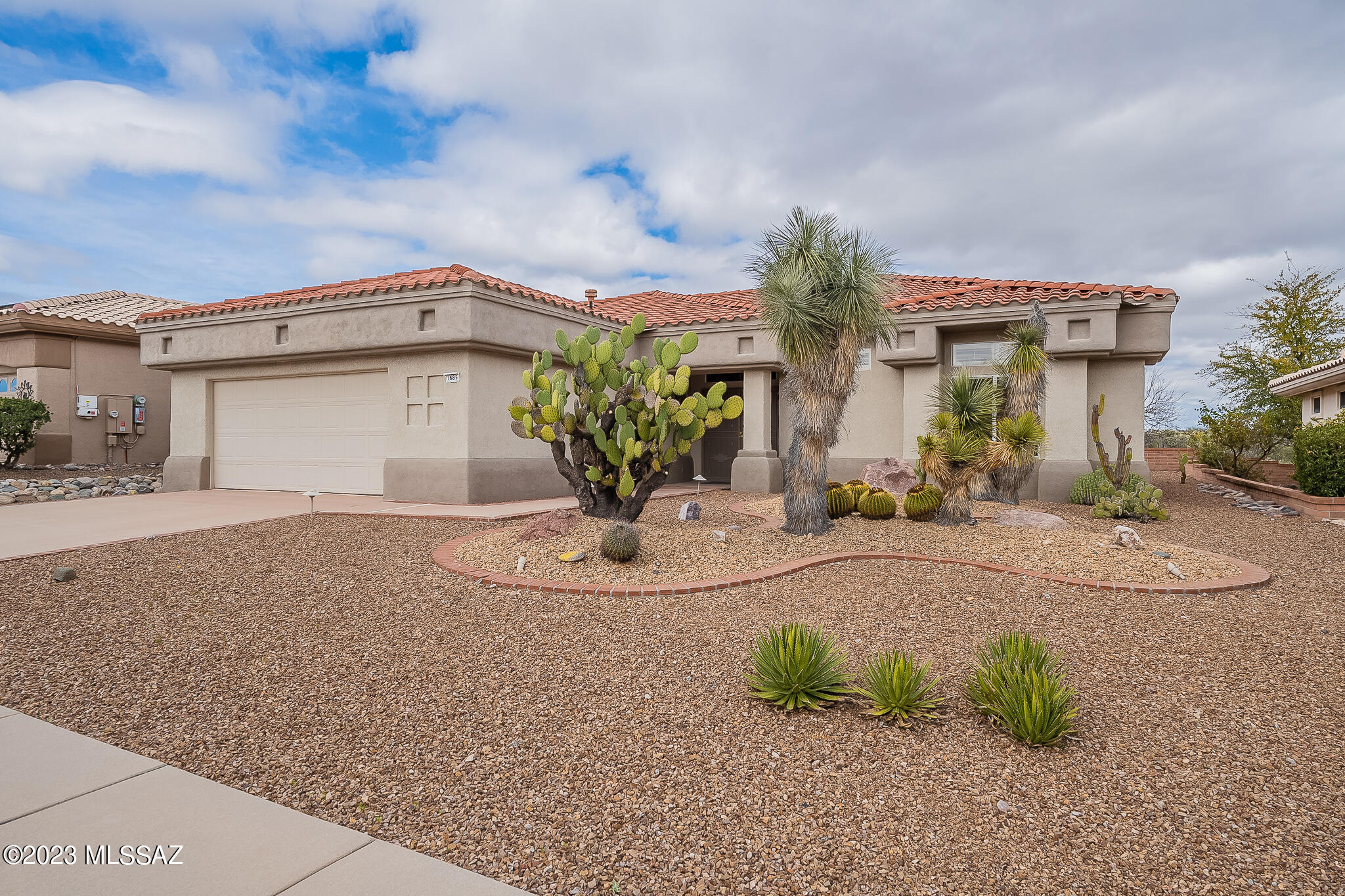 Looking for a move-in ready home? This is it!  All new KitchenAid appliances, new granite counters, new kitchen sink, fresh paint throughout, new travertine tile & new carpet.  Enjoy privacy & mountain views from this premium lot backing up to hundreds of acres of state land.  Updated  kitchen with great cabinet space is open to family room with gas fireplace.  Huge living/dining area with walls of windows overlooking beautifully landscaped yard & open space.  2 bedrooms PLUS an office off of the kitchen. Primary suite is  spacious with large walk-in closet, soaking tub & separate shower. Garage with storage, newer HVAC & water heater. Take advantage of all that Sun City Vistoso has to offer including exercise facilities, pool/spa, tennis, racquetball, dining, golf and so much more!
