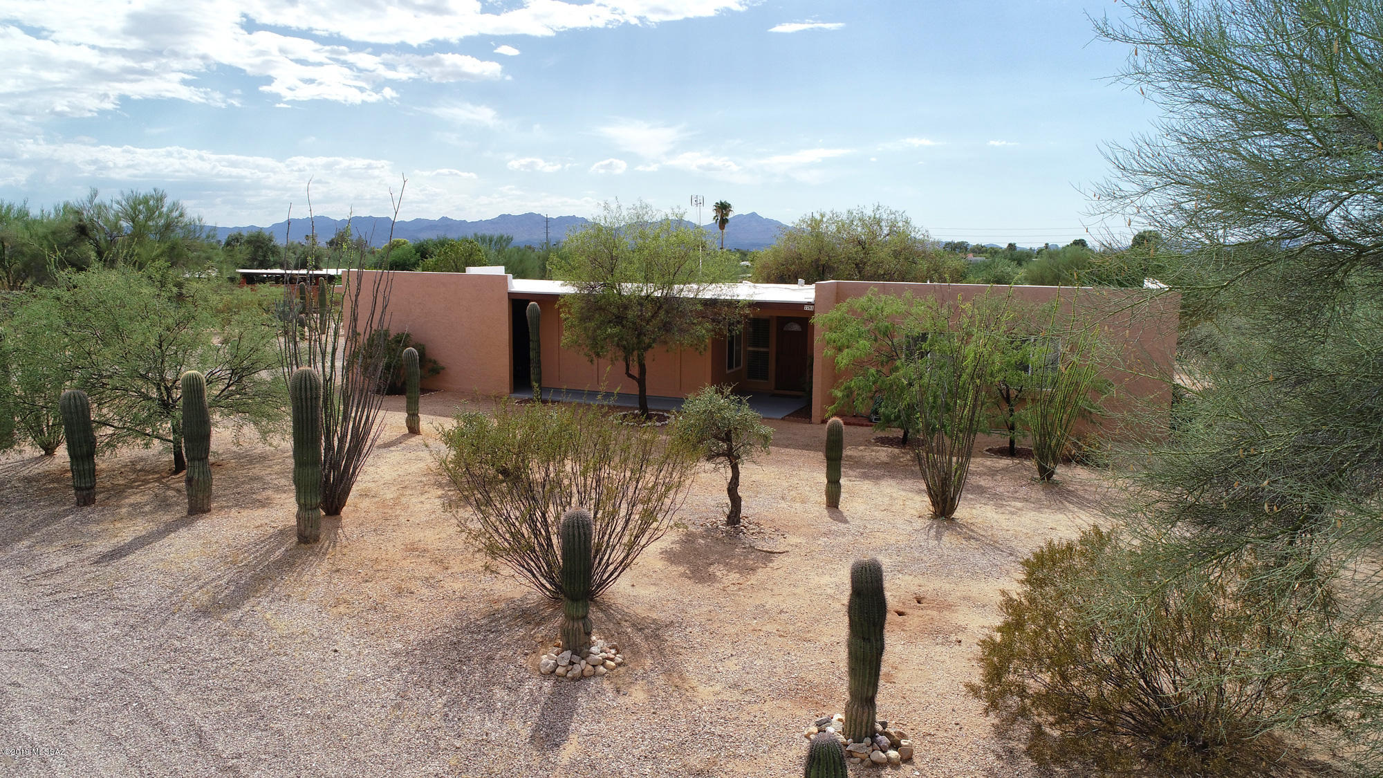 Great property on .8 acres presents amazing privacy, easy care natural desert yard and pleasant surroundings with mountain views. Well cared for home offers 3 spacious bedrooms and 2 full baths, well appointed living and family room with open concept kitchen. Laundry room with washer and dryer are right next to the kitchen! Good size workshop adjacent to two car garage and covered patio - great outdoor space if you like home projects. Plenty of room for RV parking. No HOA! This property is just minutes away from Tohono Chul park, hiking trails, Whole Foods, Safeway, Northwest hospital and many other amenities. Great home! Call for an easy showing!