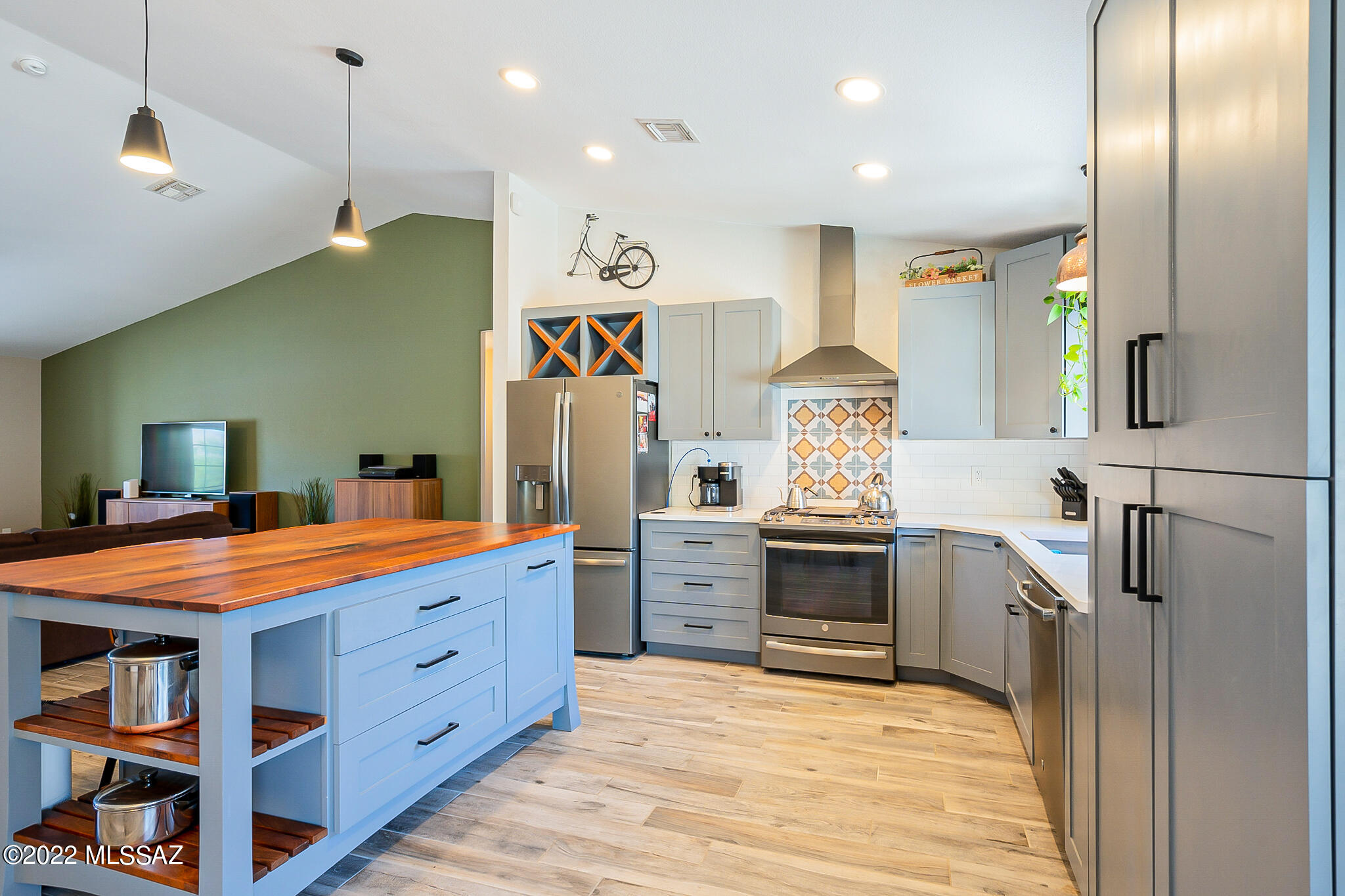 A lovely remodeled K E & G Home tucked on a Corner Lot in a popular neighborhood. Energy Efficient, Open Floor Plan, Vaulted Ceilings, Large Kitchen with Custom Kitchen Hood Vent, Oversized Kitchen Mesquite Top Island, Quartz Counters, Under Cabinet lighting with wireless control, Soft closed Cabinets and Drawers, Stainless Appliances, Large Pantry closet, Whole House Water Filtration System, OWNED SOLAR with a Sense Energy Monitor to monitor solar panel output, NEST Thermostat, Bedrooms and Baths offer newer Fixtures and Lighting, Closet Barn Door Sliders, Newer Gas Water Heater 2019, NO NOA, NO POLY PIPING, an easy care Backyard, private and tranquil.