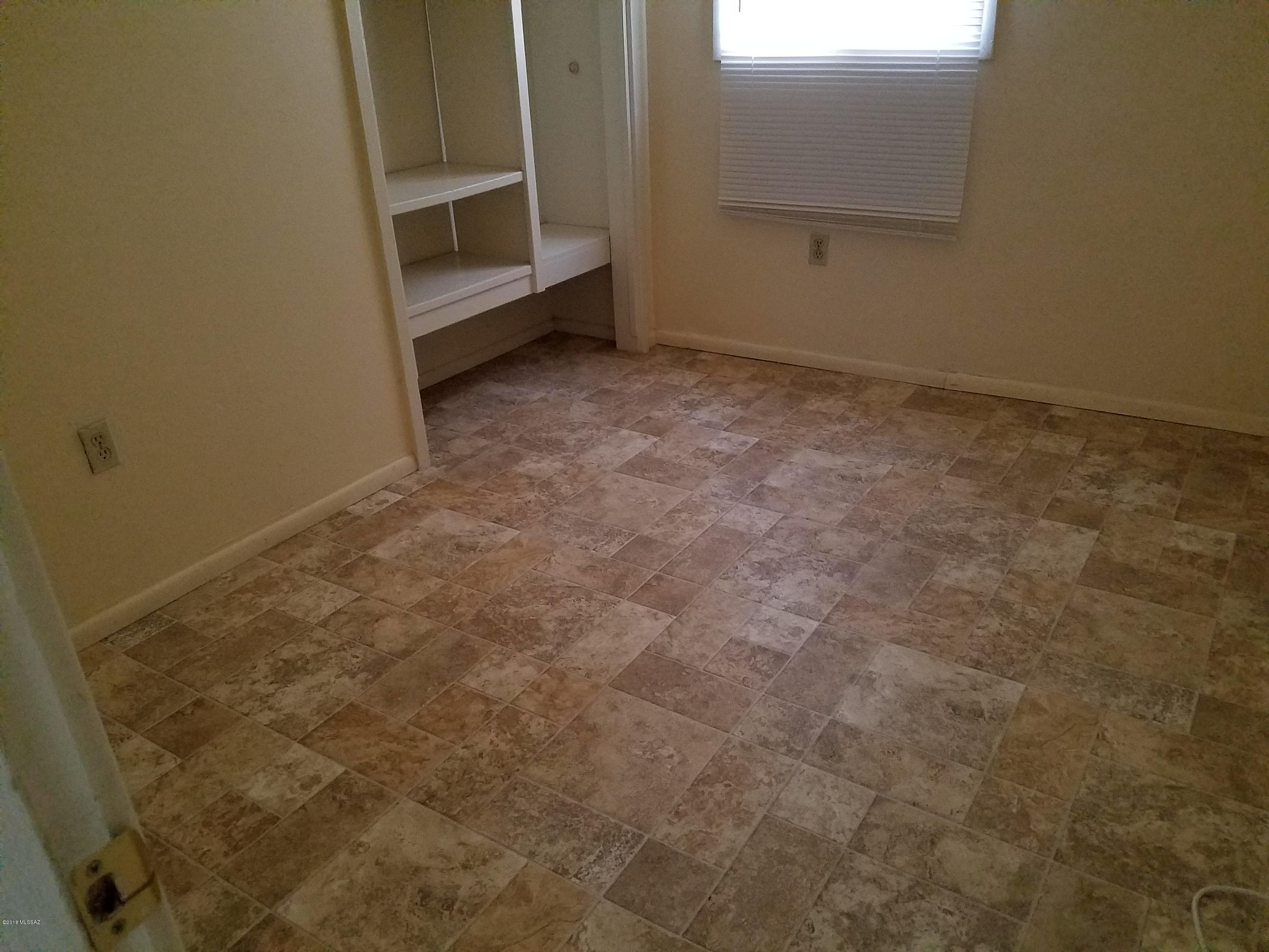 2 Br, LR, Ba, Computer Room and Kitchen. Big Fenced yard fpr pet with  Pet Fee and owners approval, Walk or Bike to the UofA, close to shopping centers,Restaurants, Bus Stop, Banks. Owner pays water, Sewer and Trash. Window AC in Br's and evap if you choose to  use it  instead. Enclosed off alley parking on property