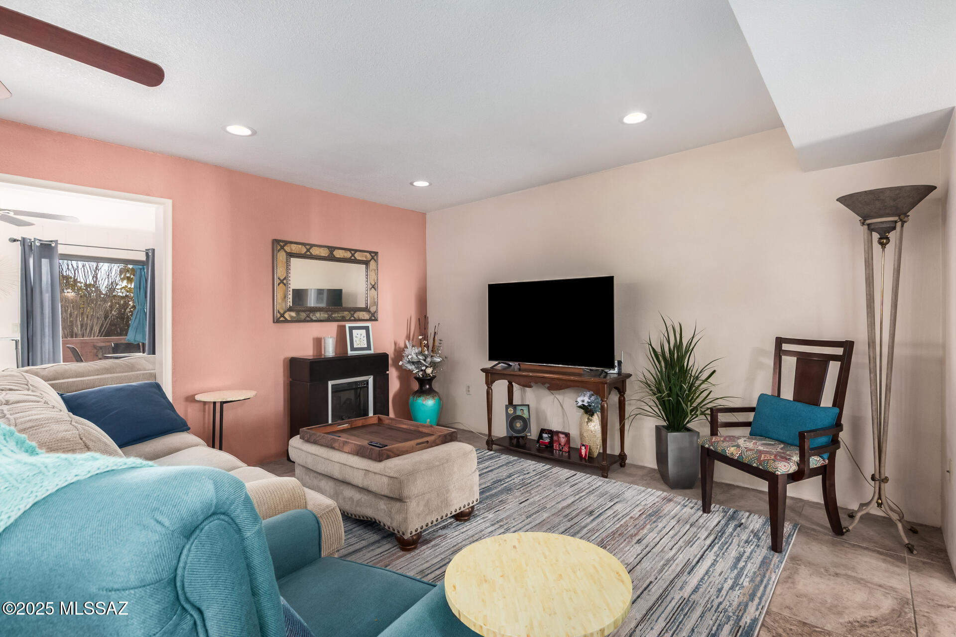 Back on the market due to the buyer's unexpected medical issue.

Own this delightful end-unit townhome on a desirable corner lot, with stunning views of the Santa Rita Mountains! Located on a quiet, no-exit street, this 2-bedroom residence welcomes you with a convenient garage, stylish pavers, an easy-care landscape, and an inviting patio. Inside, you'll find a cozy living room with a contemporary palette, recessed lighting, and durable tile flooring. The family room is bright and airy, with abundant natural light from sliding doors that lead to the backyard, offering seamless indoor-outdoor living. The kitchen is equipped with solid surface counters, crisp white cabinetry, sleek stainless steel appliances, and a serving window with a breakfast bar. Both bedrooms feature carpeted floors, spacious closets with mirrored doors and updated ensuite bathrooms with stylishly tiled showers, complete with built-in seats, and tiled flooring. Enjoy quiet outdoor moments on the paver patio, offering stunning mountain vistas. Plus, this home is conveniently close to shopping and recreation. Make it yours today!