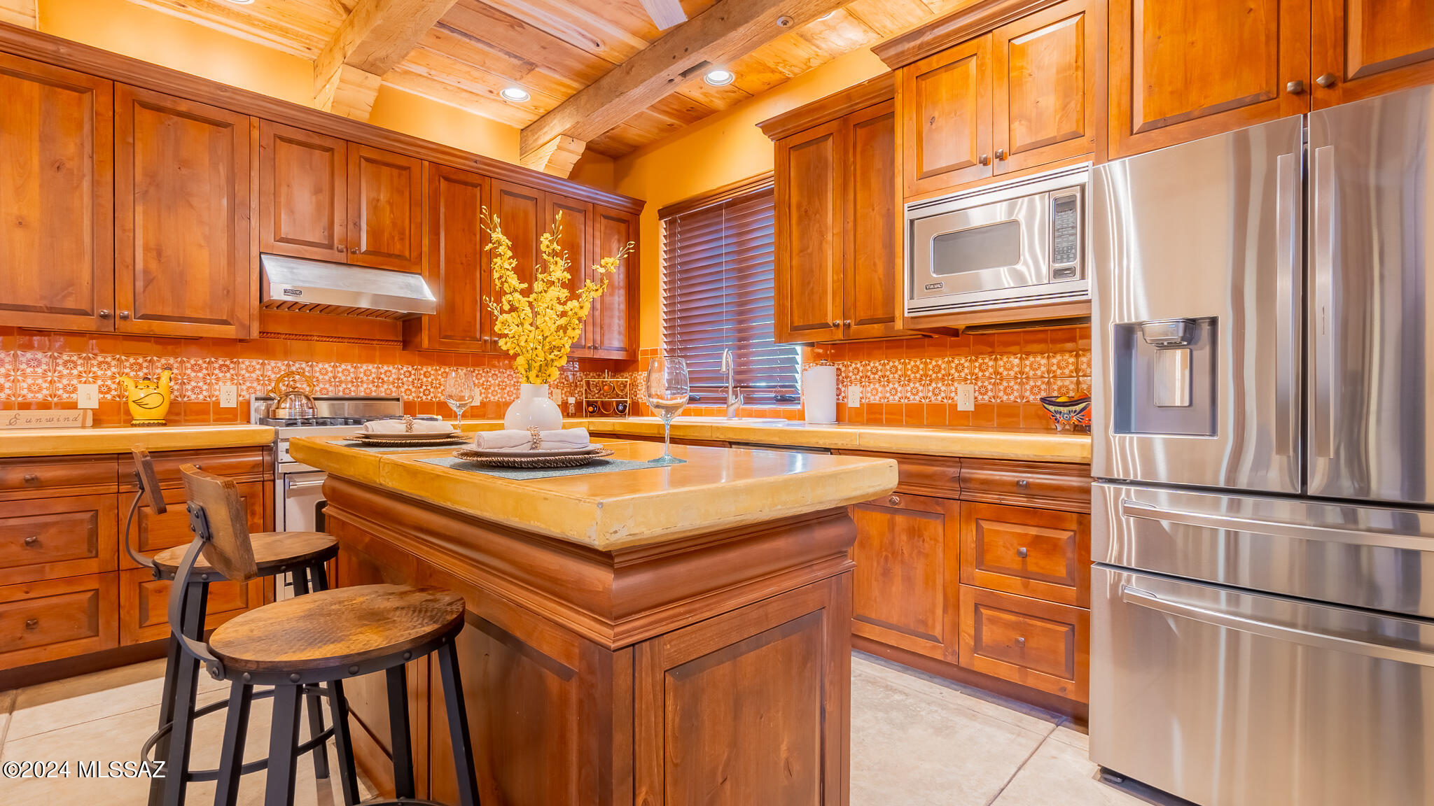 LOCATION, LOCATION, LOCATION! Here is your opportunity to reside in the prestigious Mercado San Agustin or explore an opportunity to OWN A PRIME AIRBNB! This exquisite home offers 2 Master Suites, with one conveniently located on the main floor along with 4 baths and an office/den. This Spanish style masterpiece includes stunning features and begins with 9' hand-forged front entry gate that opens to a covered patio and Atrium, and is accompanied by a cozy gas fireplace that offer a luxurious touch. Additional features include the stained post tension concrete floors throughout, old barn wood ceilings, concrete countertops and SS Viking appliances. If you want entertainment, you are 1 mile from downtown Tucson and only steps away from the San Augustin Mercado which offers fine dinning and local shops, the modern street the Chuck Huckleberry Loop. If you've been looking for the perfect home and neighborhood then this is it! Call and schedule your private tour today!