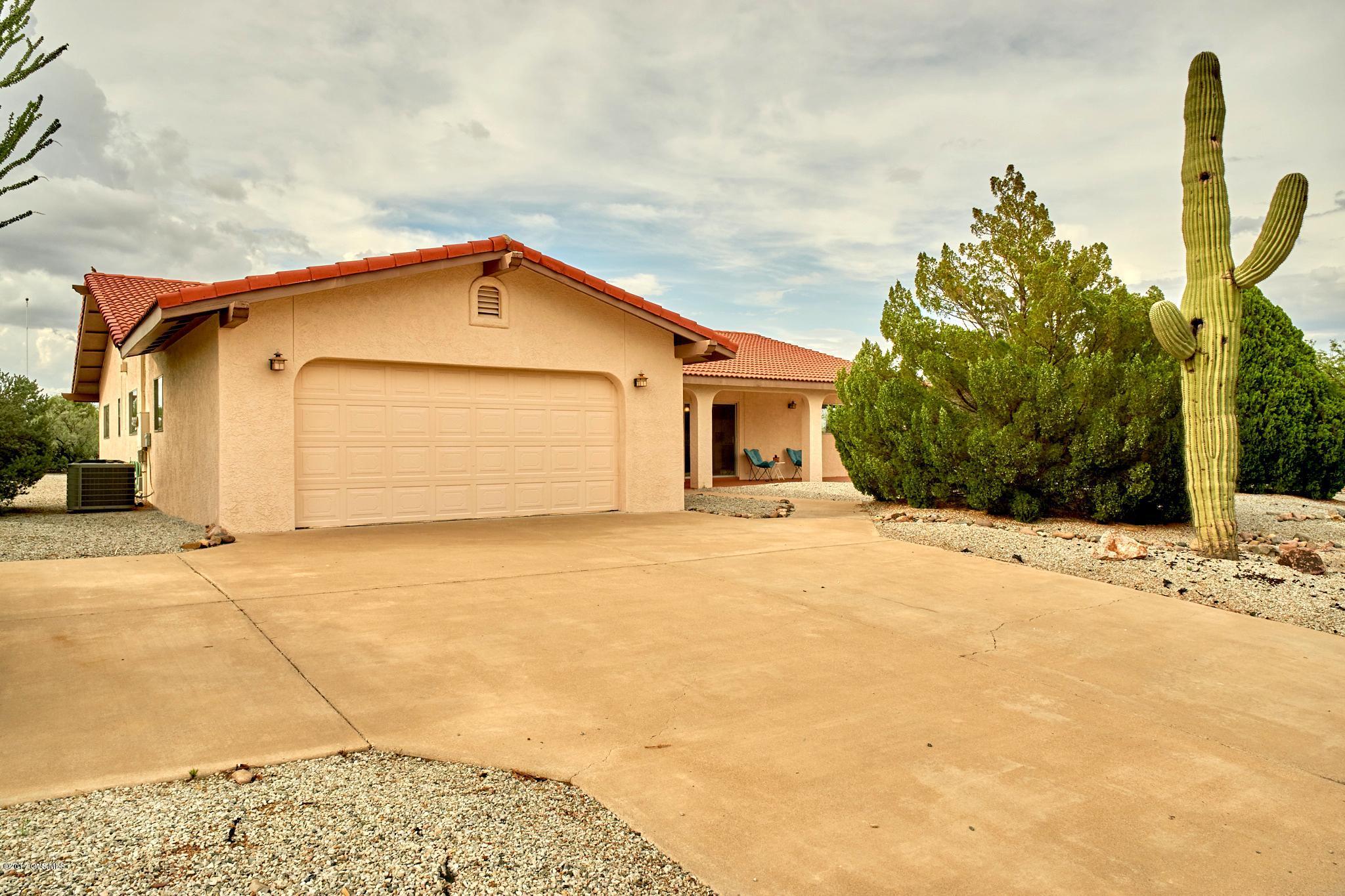 Lovely front views with a large 21000+ lot. Move in ready. Large kitchen with lots of cabinets. New stainless stove, dishwasher and microwave. New carpet in living room and Arizona Room. Close to GVR West Center and Conveniences. Work benches in garage and backyard storage room. Spacious private back yard.