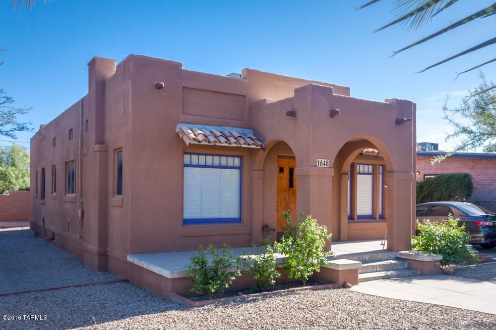 Location, Location, Location!  Terrific 8% Cap duplex next to the UofA.  Home has always been rented & was recently renovated.  Main house offers wood floors, remodeled kitchen 2 beds/1 bath & laundry room, NEW AC '13.  Kitchen has granite counters, new cabinets & built-in dining area.  Bathroom has original cast iron free standing tub/shower.  3 Parking spots for main house in front. Main house has a fully furnished studio w/kitchen & Â¾ bathroom, NEW ductless AC '13 system & private entrance.  Guest house in back was built in 1997 & offers 2 parking spots & washer & dryer.  Guest house has living area, dining area, laundry, 2 beds/1 bath & AC!  All appliances in each unit convey.  Exterior recently repainted.  Each unit is in great condition.  Plenty of off street parking for tenants.