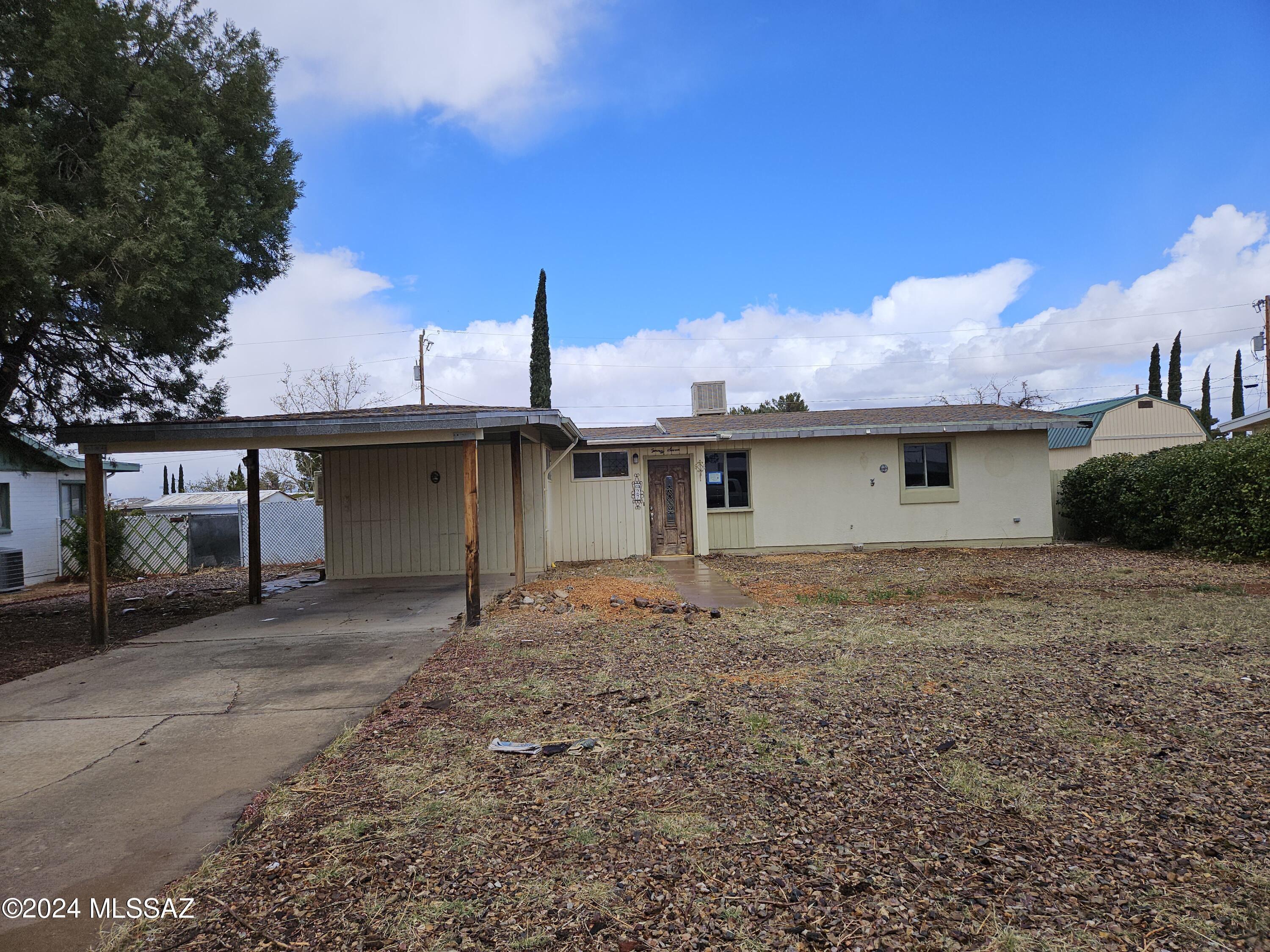Opportunity knocks! This 3 bed 2 bath, 1,291 sq. ft. home is in the center of town. Close to all in town amenities. Chain linked backyard with storage shed. 1 car carport. With some TLC this home can really shine again!