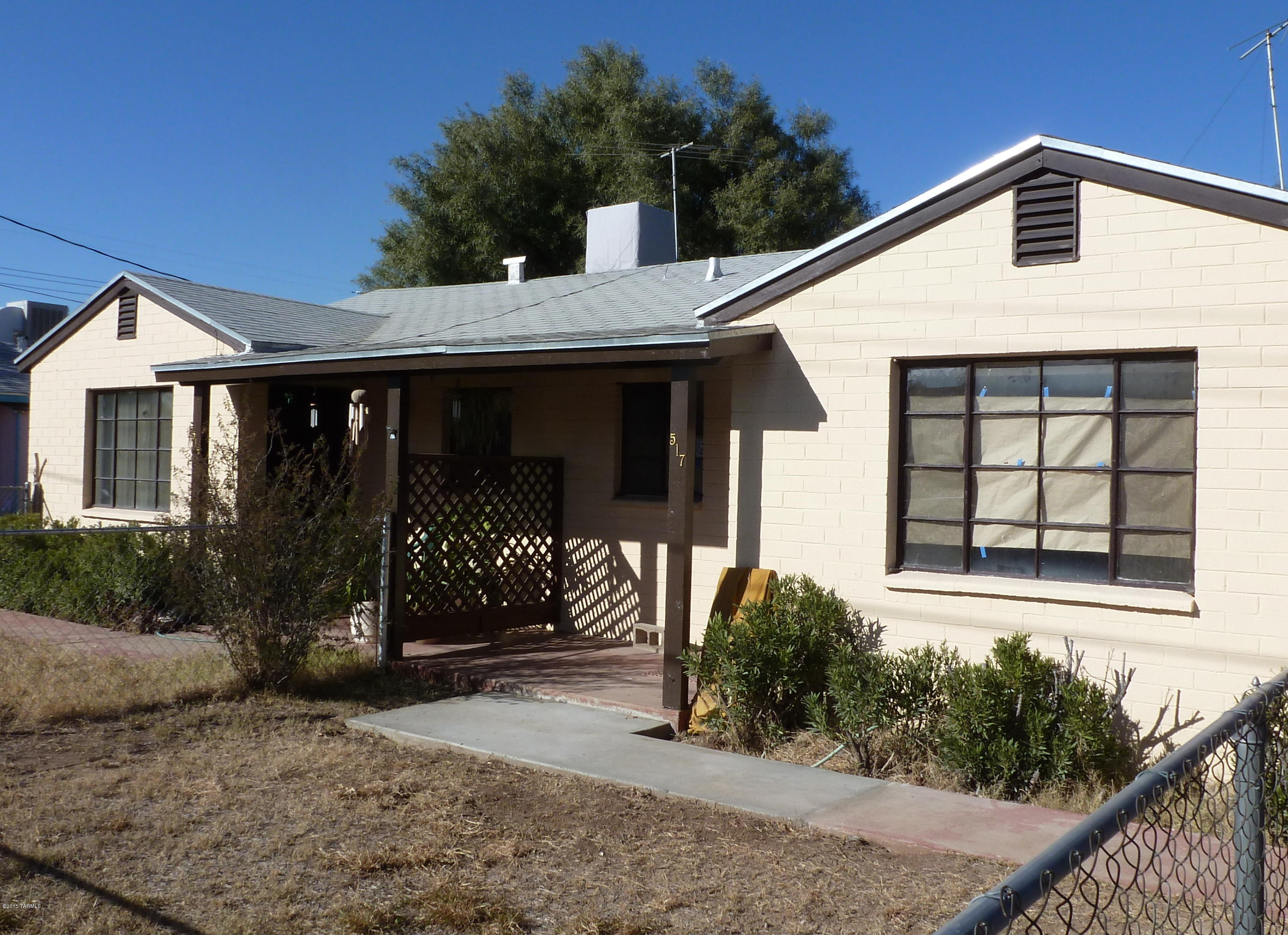 Wonderful opportunity to own this spacious duplex.  Each unit offers 1 bedroom, 1 bath, spacious living room and a good size eat-in kitchen plus a large back yard.  Each unit also comes with laundry hookups & a parking space where you could park 2 cars in tandem. One of the units has just been renovated. Property would make a great income property being close to the UofA.