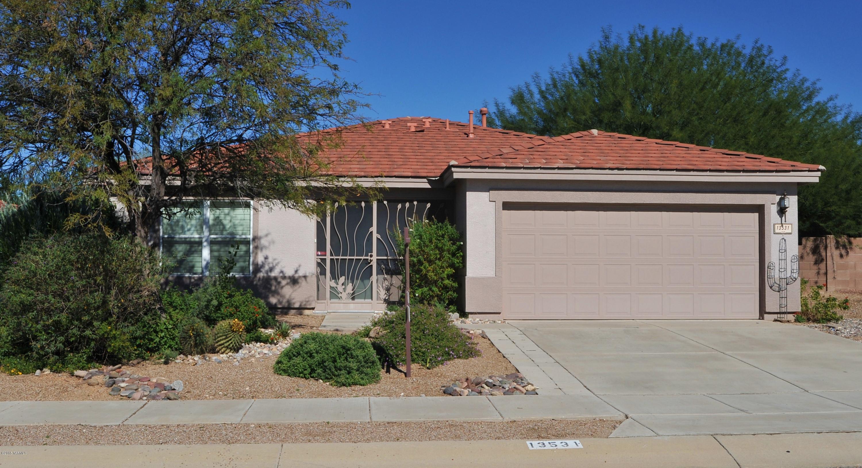 Beautiful, bright + open floor plan, 3BD w/a den/office (or use as 4th BD). Upgraded Kitchen w/island & breakfast nook opens to large family room. Formal LR + DR. Enclosed Az room. New AC (09/2015)& newer water heater. Water softener. North/South facing lot. Backyard faces the 15th hole on Del Lago Golf Course. Mountain Views. Low care backyard w/mature landscaping...Desirable Vail School District. Don't miss this gem!