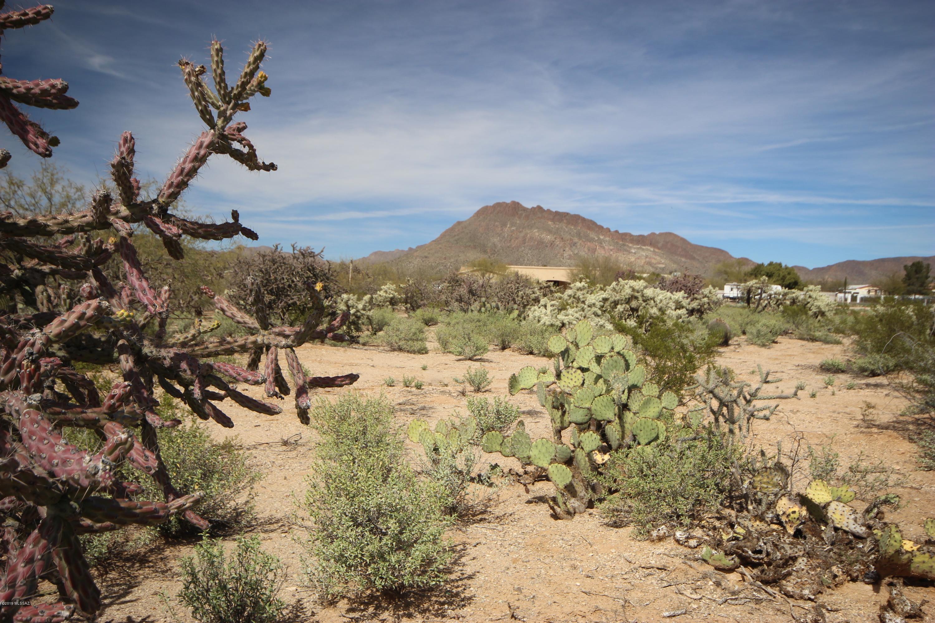 Wonderful corner lot with mountain views! Ready for your new home.  No mobile homes allowed. Rural feel, but close to shopping as well as an easy drive to Old Tucson Studios, Desert Museum, etc. 
Survey and SPDS under attached documents. Perc test passed 2017, septic needed.