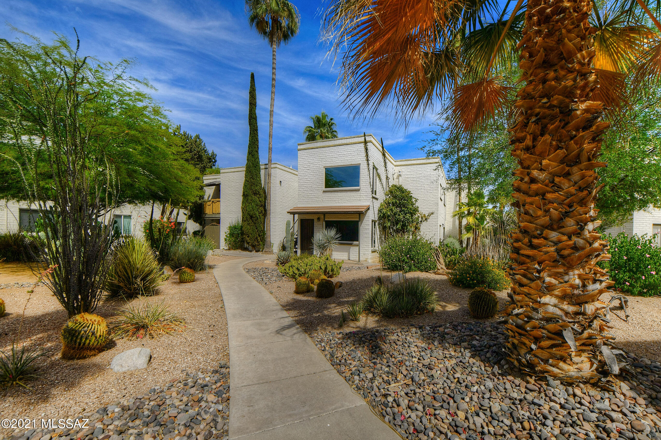 Beautifully spacious, remodeled condo with a Modern but luxurious feel inside a lovely masonry built condo complex in a great location!  Corner unit, upstairs but on one level once inside. Dramatic views of the Mountains, lush landscaping around the grounds & view of the pool area. 2 large bedrooms, 2.5 bathrooms and Numerous upgrades like Teak Countertops in the kitchen, tile flooring, soft carpet in bedrooms & Family room, Dual Pane windows throughout, low custom walnut cabinets for storage, recently painted & ready for move in!  You will love this condo complex, Masonry built with Sump block, HOA fee covers Water, trash/sewer, roof, pool/spa, laundry facilities, exterior building & community pest control. Buy to live in or rent it out- many possibilities!