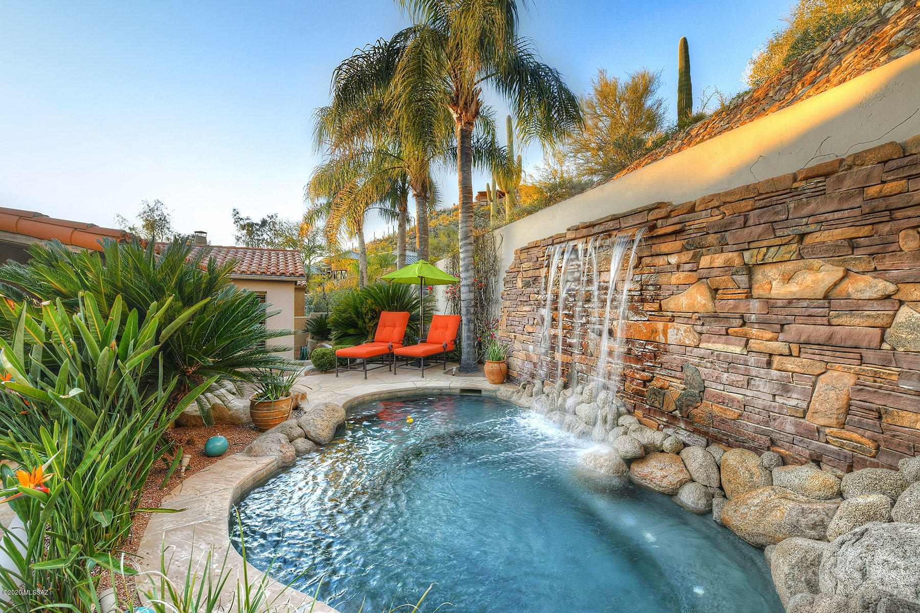 One of the best David Baird built homes in Ventana! Santa Barbara style exterior finish featuring charming courtyard entry, classic travertine floors throughout. Vaulted ceilings create open, light space. Living room includes canterra FP & mantel. Gourmet Kitchen w/high-end appliances incl. Sub Zero, Asko, Viking, Wolf double ovens, warming drawer, wine & beverage frig. Cooks will enjoy the large island w/luxurious granite, vegetable sink w/instant hot water faucet. Master Suite offers city lights out of your private balcony. Entertain w/Smart Lighting & Sound System throughout this opulent home. Ultimate private covered patio w/built in BBQ, lush landscape w/palm trees, newly renovated salt water spool w/waterfall & wi-fi automated control. Tiled garage, home is in Immaculate condition.