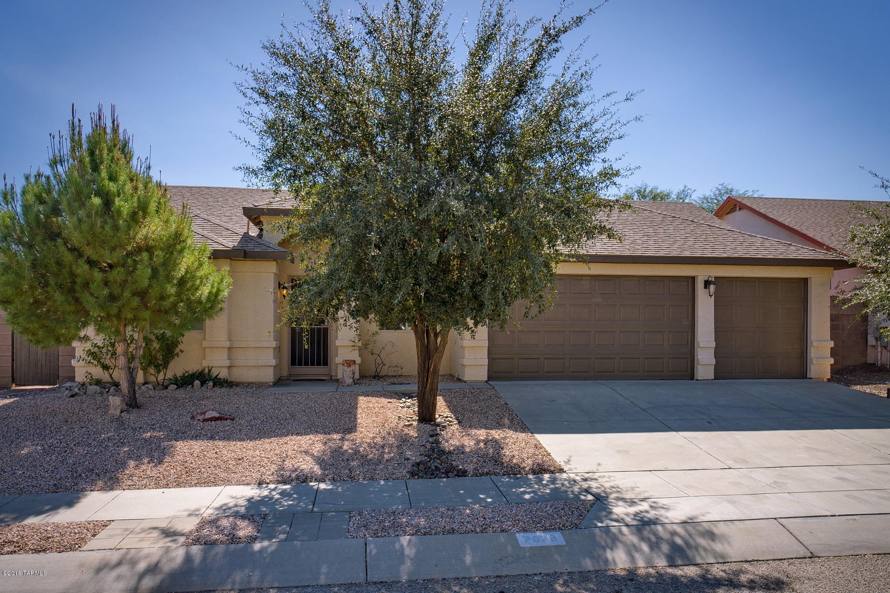 Located in a great neighborhood, this home been beautifully remodeled and updated.  The spacious open floor plan features a split bedroom plan with three large bedrooms and a den that can be used as an office or hobby room.  The living and dining areas lead into a beautifully updated kitchen with stainless steel appliances, new white cabinets, and a cozy breakfast nook.  The family room is open and inviting and features a fireplace, built-in entertainment center, large windows and access to the elegantly manicured backyard.  The large backyard offers a covered patio, kiva fireplace with sitting area, new outdoor sink, and lush plant life including fig and citrus trees.  The large three-car garage has built-in attic storage with pull-down stairs for convenient access.