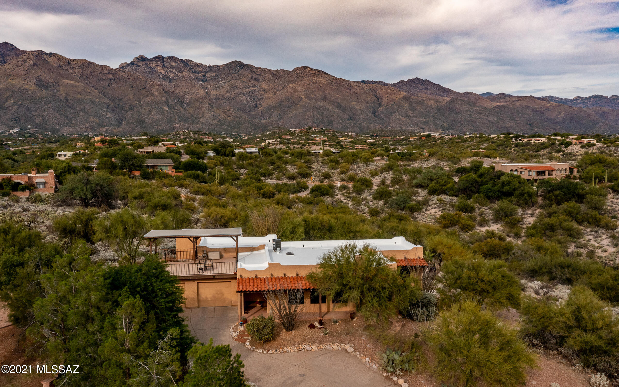 Fabulous Mountain and City VIEWS! Natural desert surrounds this lovely home. Owners remodeled this 3 BR/2 B, 2164 Sq. Ft. to be their ''Forever Home''.  Living room with a wood burning fireplace and view of the twinkling city lights. Kitchen features Hickory cabinets, Granite countertops, Stainless appliances and 5 burner gas stove. New tile floors throughout. Family room with fireplace. Enclosed porch/catio. Sparkling pool was replastered and tiled, new pump in 2021. New HVAC system and roof recoated in 10/21. See list of updates in Documents.