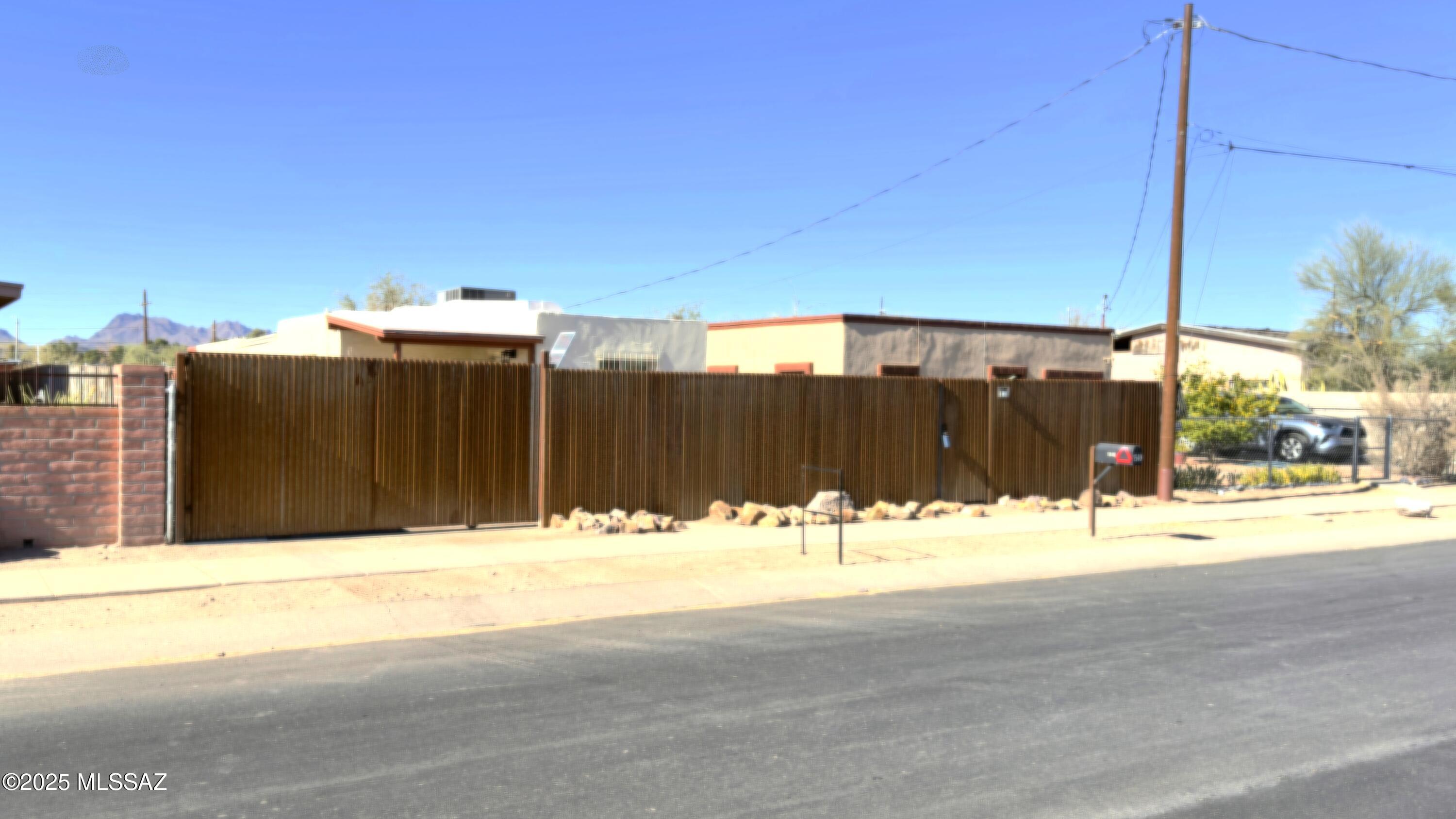 Beautiful cozy bungalow in a move-in ready condition with an upgraded house electrical panel. The Electrical panel was upgraded to 200 amp last year (August 2024), Also a 50 AMP RV hook up was installed!

Stainless steel refrigerator.
Tiled floors throughout.
Washer and dryer included.
Fenced property with Solar Front Gate with remote.
Large R2 lot with lot of potential and possibilities.
Located right on the Santa Cruz bike loop within close proximity to Freeway, Downtown and UOA.