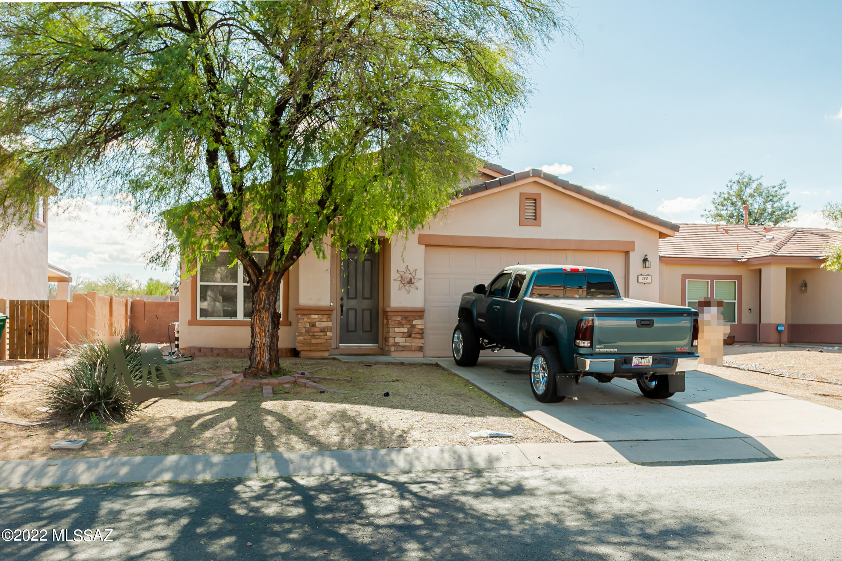 This lovely move-in-ready 4bed 2bath 1story in the popular and desirable Award Winning Rancho Sahuarita is your new home! Spacious living room at the front perfect for entertainment. Good sized kitchen opens to dining area & family room. Big en-suite master with door to backyard & walk-in closet. Nice master bathroom w/double vanity. Lovely backyard w/covered patio & citrus trees. Attached 2-car garage. Very convenient location, near freeway I-19, casino, stores, shopping, dining, business & entertainment. The community offers many amenities, club house, parks, pool/spa, playground, sport fields. Come see today!