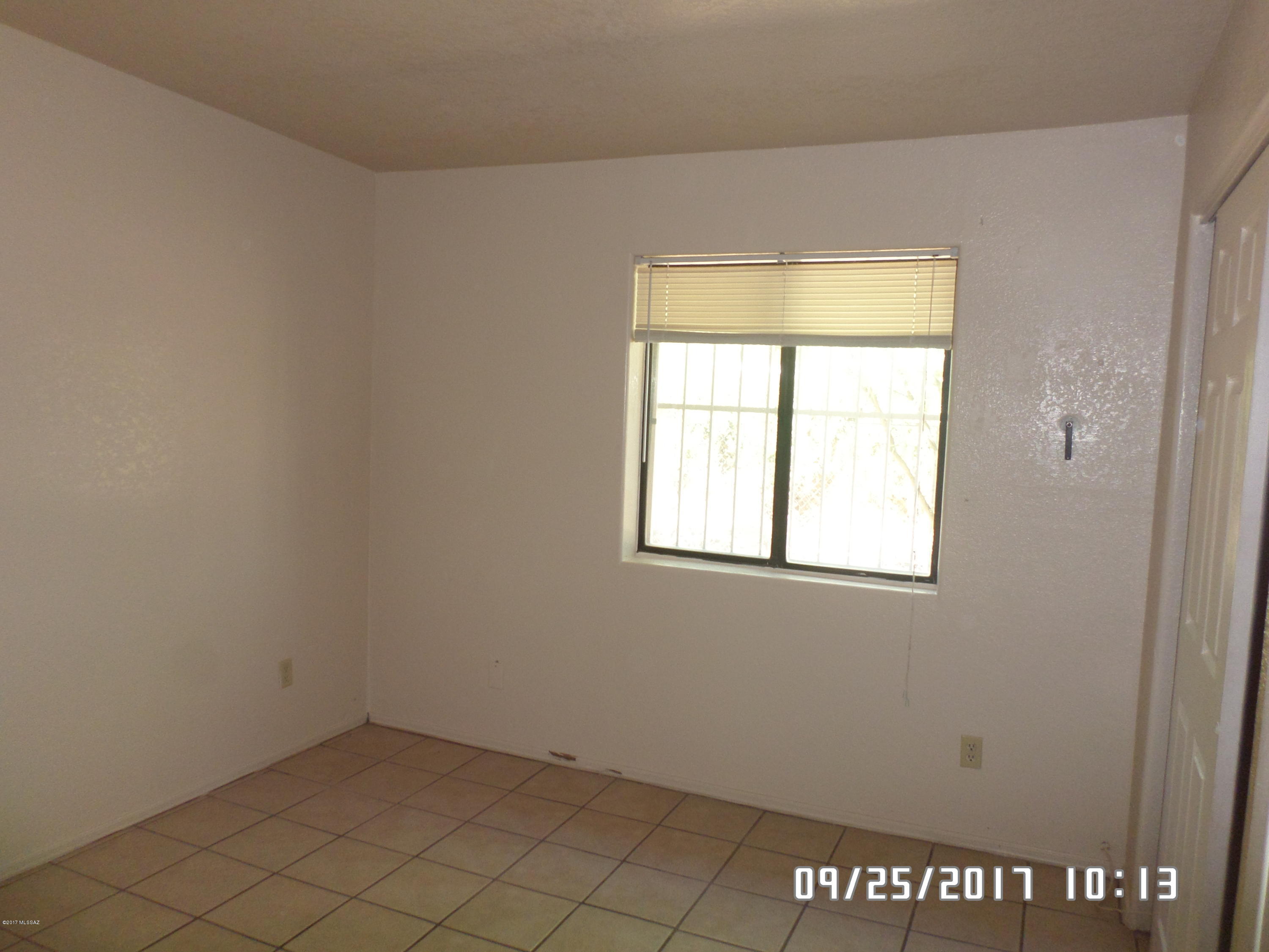 This is a 3BR/1.75BA House located just across I10 from Downtown TUCSON! There is ceramic tile floors throughout and AC so the long hot summers will be no issue. There is a laundry/storage room under the carport with W/D hook-ups. The master bathroom has a custom walk in shower. There is a bonus extra room that can be used as storage or possibly a workshop. The entire property fenced. Pets are negotiable. Call for a showing.