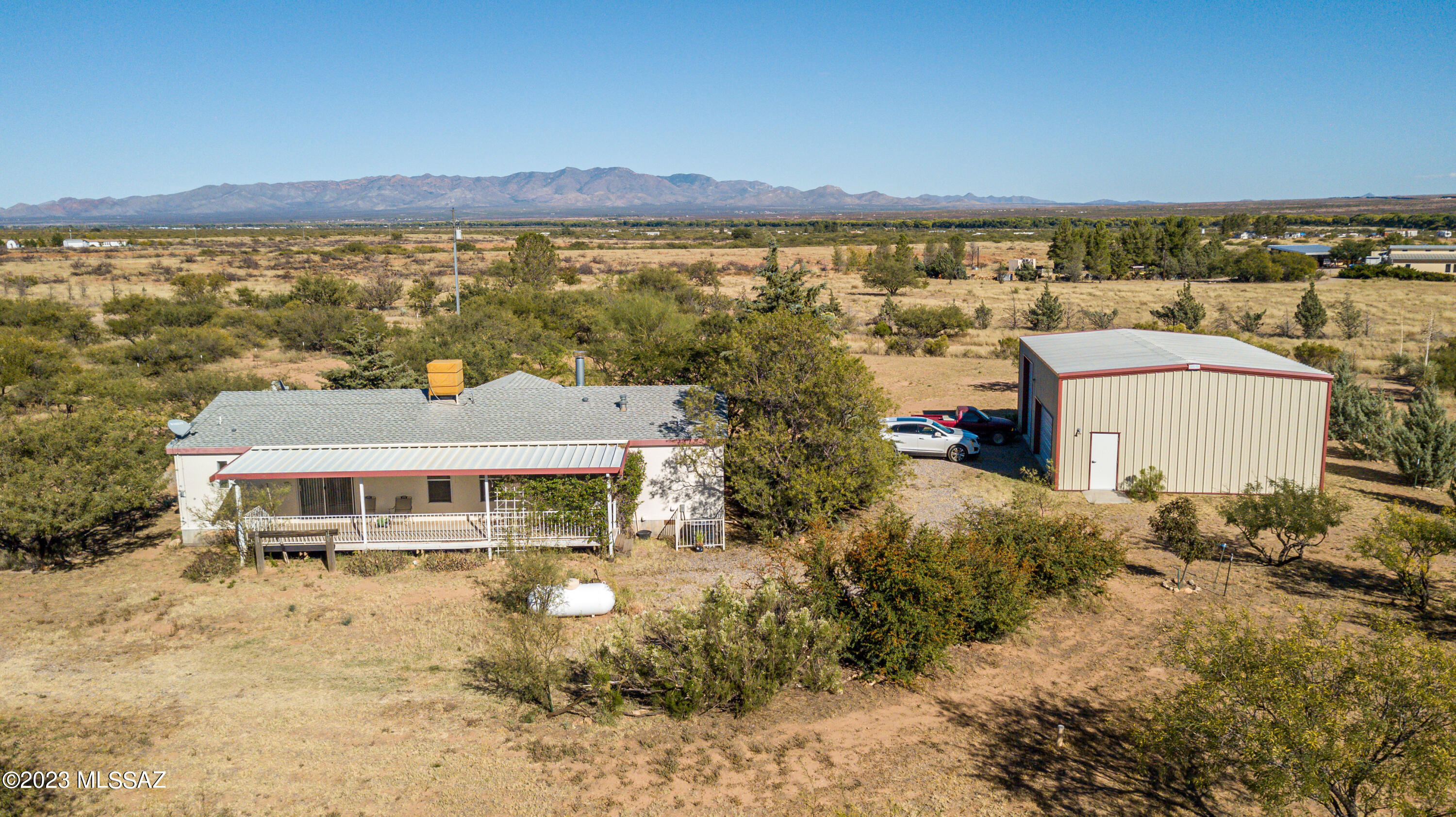 Own your own piece of paradise on this sprawling 8-acre fully fenced  property, where the possibilities are as vast as the land itself. The 3-bedroom, 2-bathroom home offers comfort with the tranquility of rural living. Home features a 30 x 40 shop with concrete floors, offering the perfect space for all your hobbies and projects. If you're an RV enthusiast, you'll appreciate the dedicated RV hookup and garage. Horse facilities with a private well. And let's not forget the star of the show - the mountain views. Gaze upon the majestic mountains that surround your oasis, offering a breathtaking backdrop.